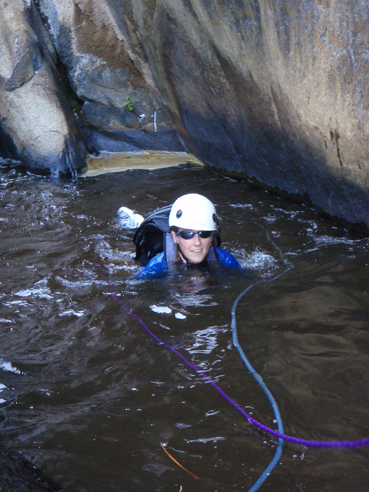 Catherine swimming in some delightfully brown water.