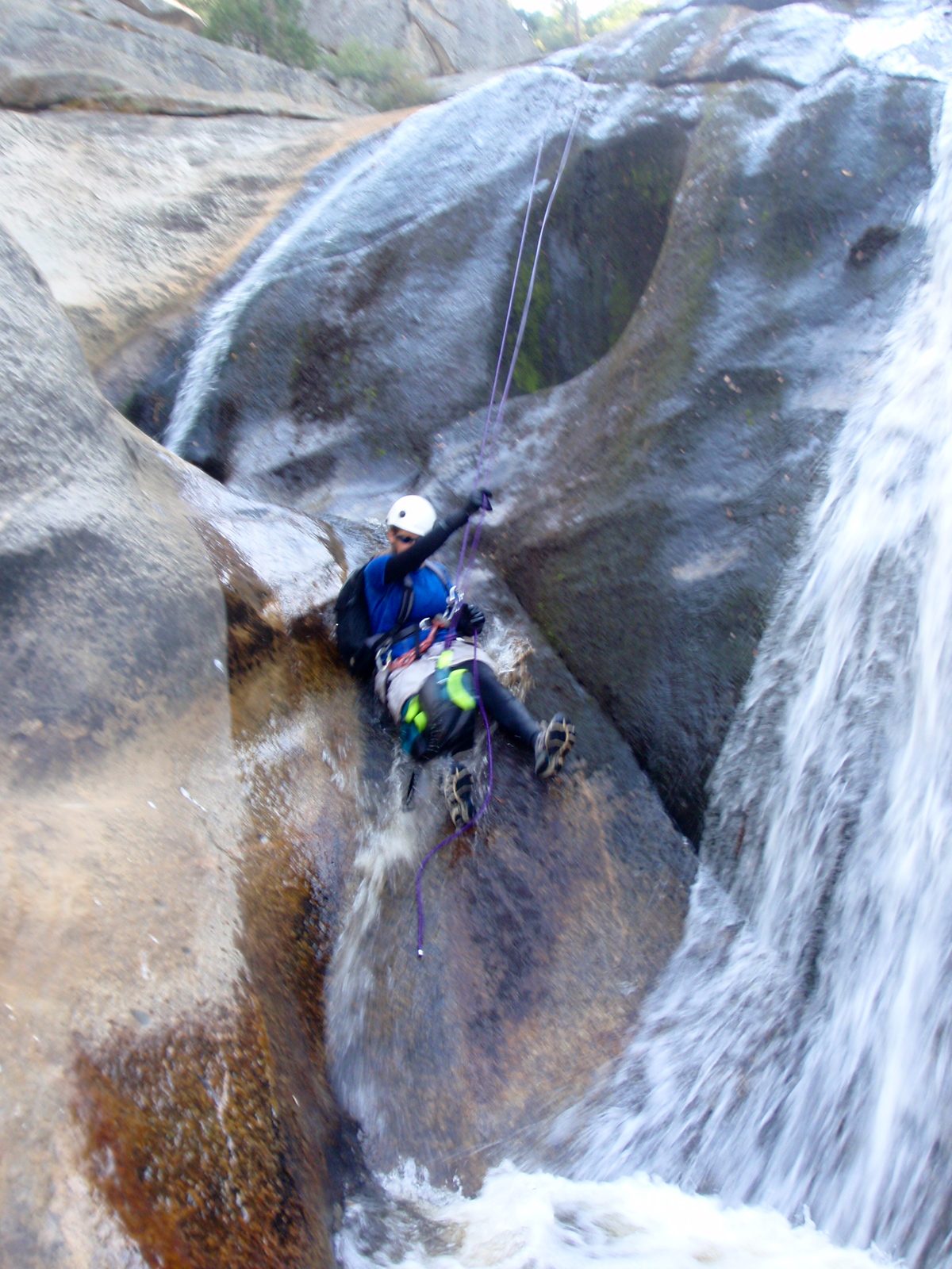 Catherine on the 4th and final rappel, sliding again.