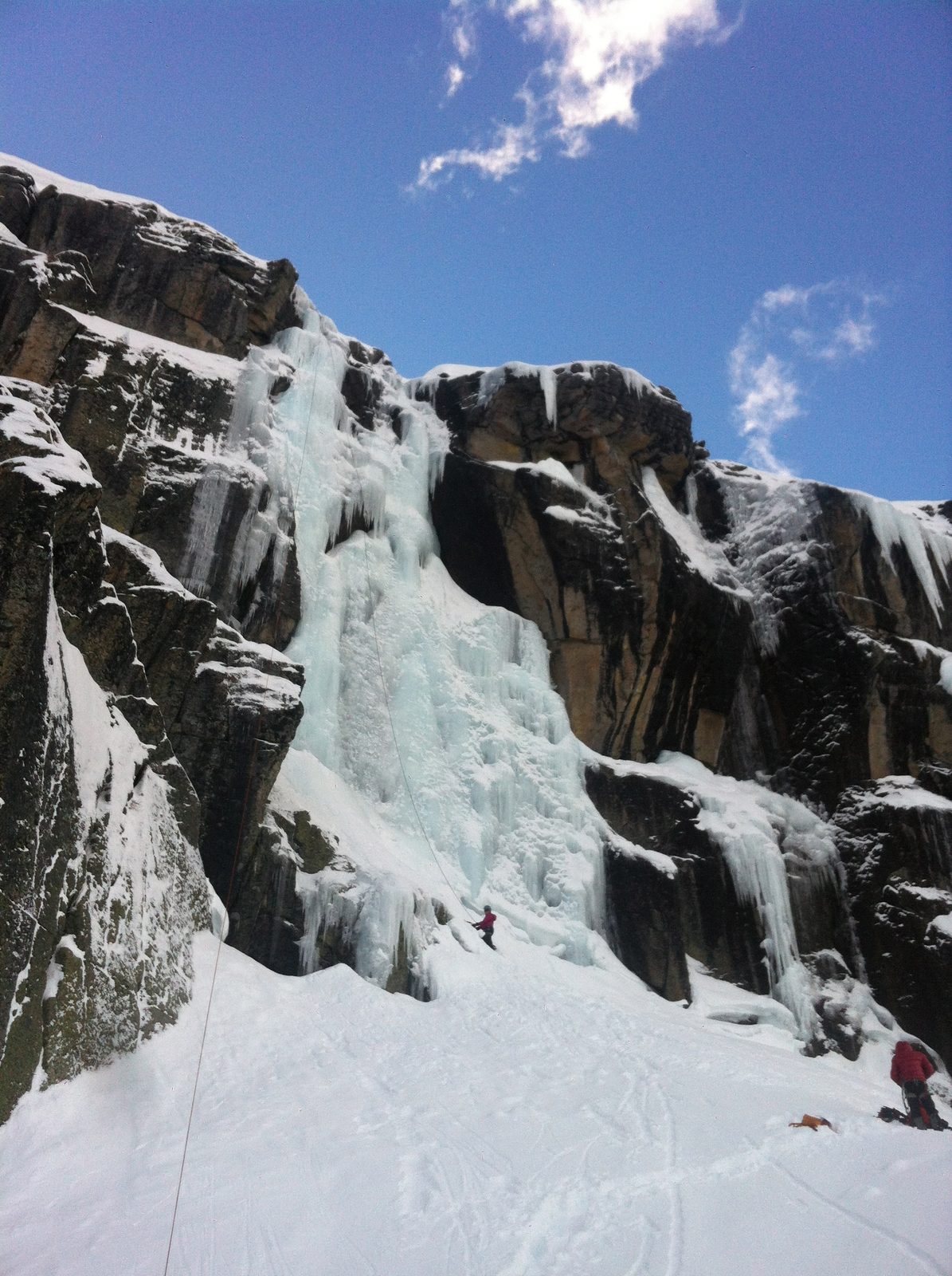 Monica gets ready to climb Code Red (WI 4+, 60 meters) at Cold Stream Canyon. Riddell looks on...