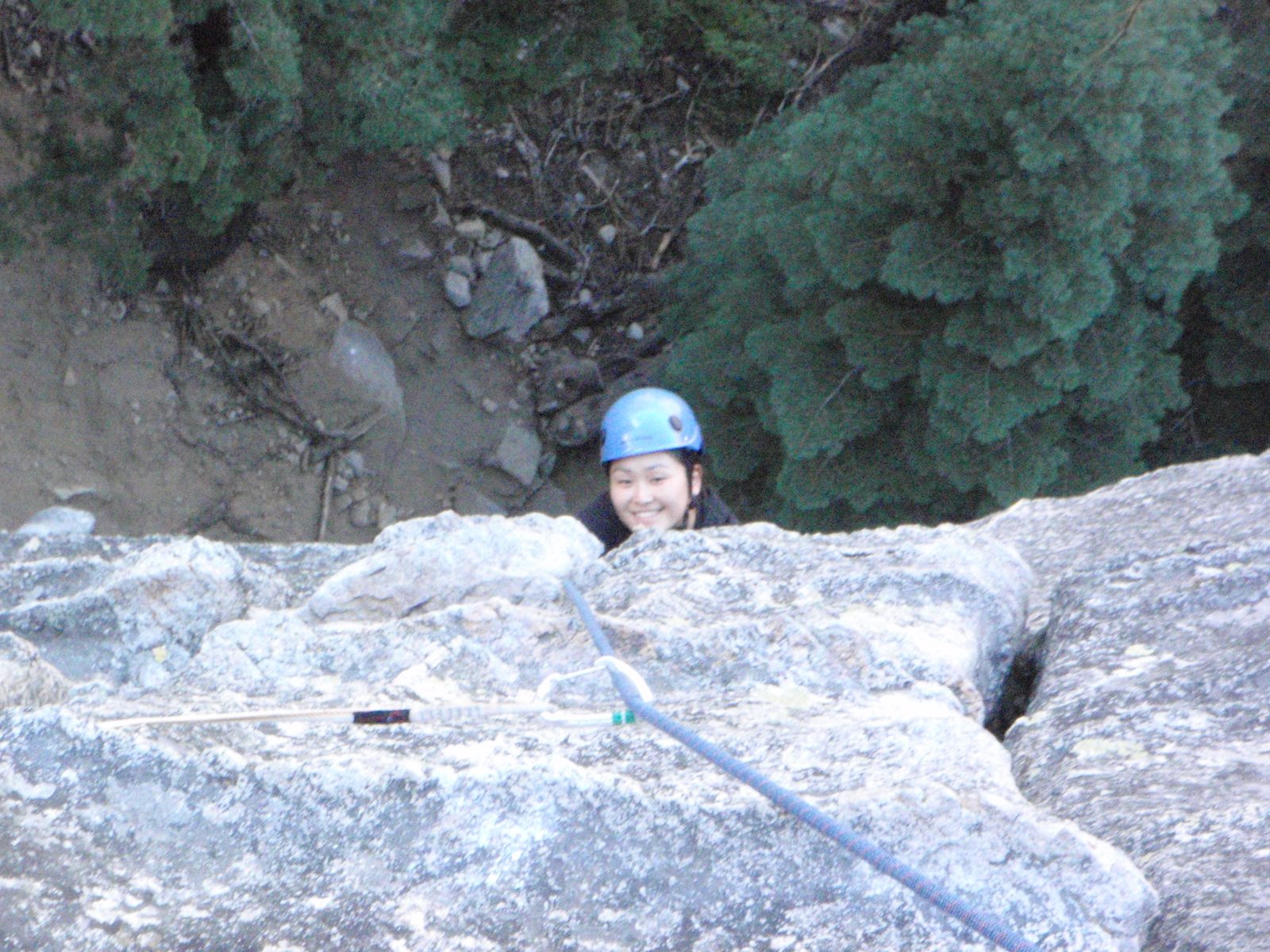 Monica, climbing the first pitch of Surrealistic Pillar (5.7).