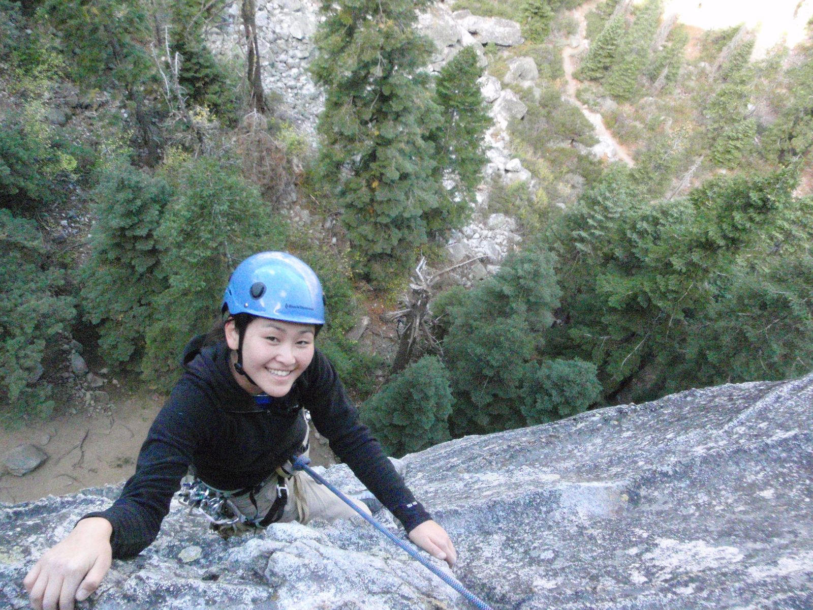 Monica, at the top of the first pitch of Surrealistic Pillar (5.7).