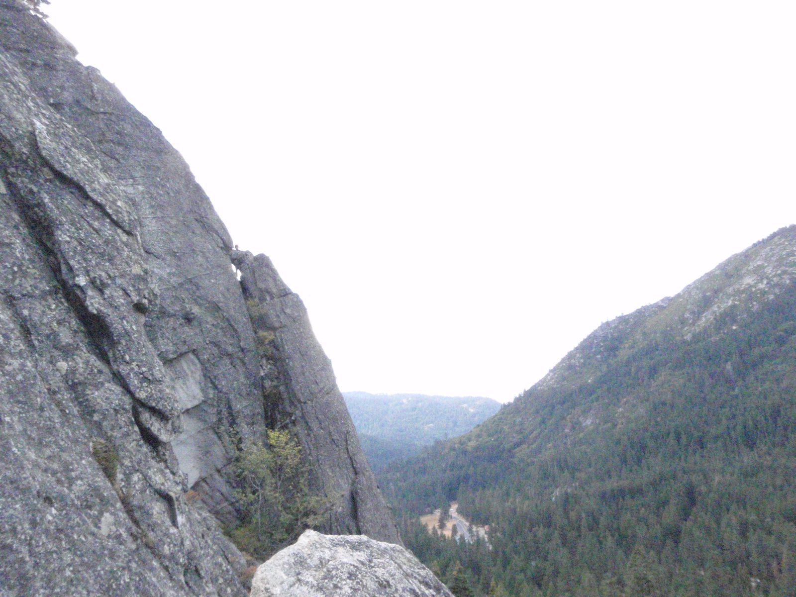 Turtle, on lead, on a neighboring climb called The Farce.  Look really hard: she is behind the...