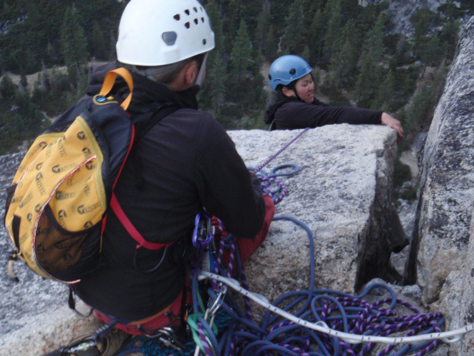 Monica, pulling the 5.9+ roof at the end of the alternate finish to Bear's Reach.