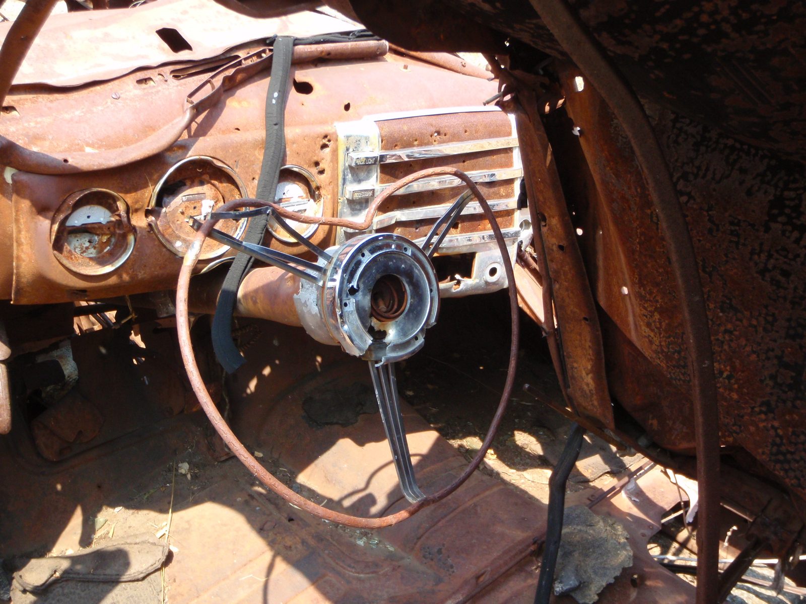 Sweet!  The steering wheel is even still there.  Check out the patina on the chrome radio buttons.