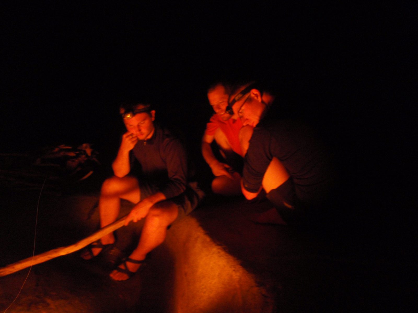 Mike, Joel and Andy staring into the fire.