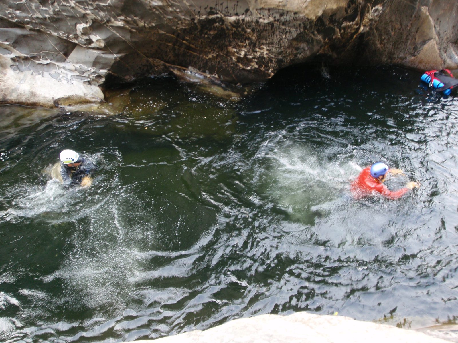 Doggy paddling down river.  Andy, Joel, and John's backpack (far right).  Better jump in quick...