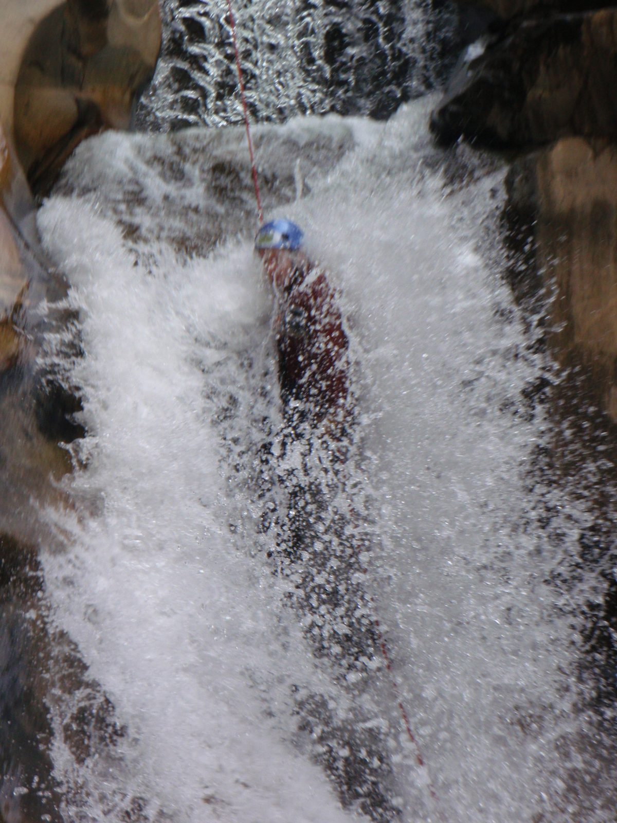 Joel, feeling a whole river wash over him as he negotiates the second half of this waterfall.