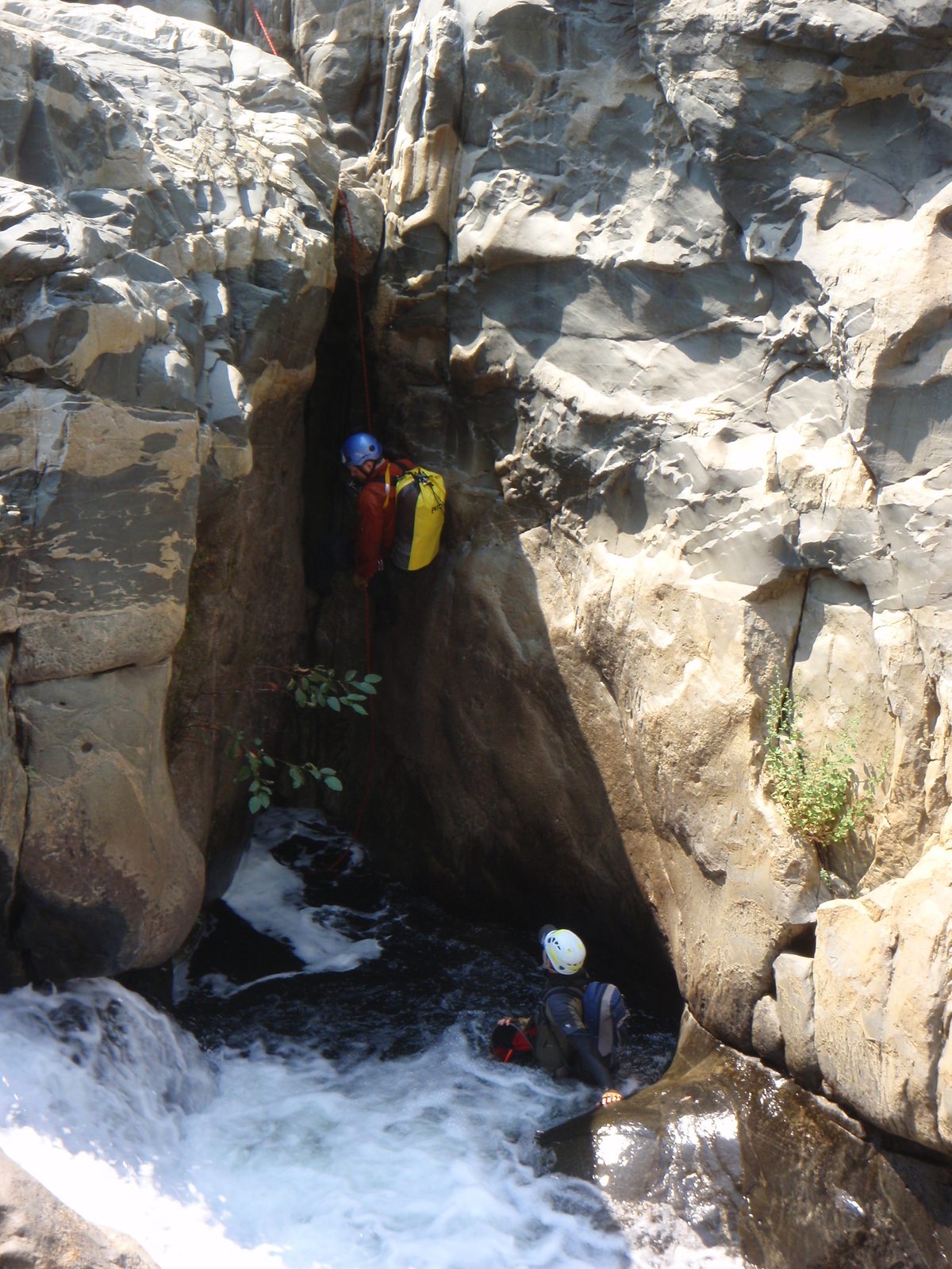 Joel on rappel as Andy (below) gives a fireman's belay.