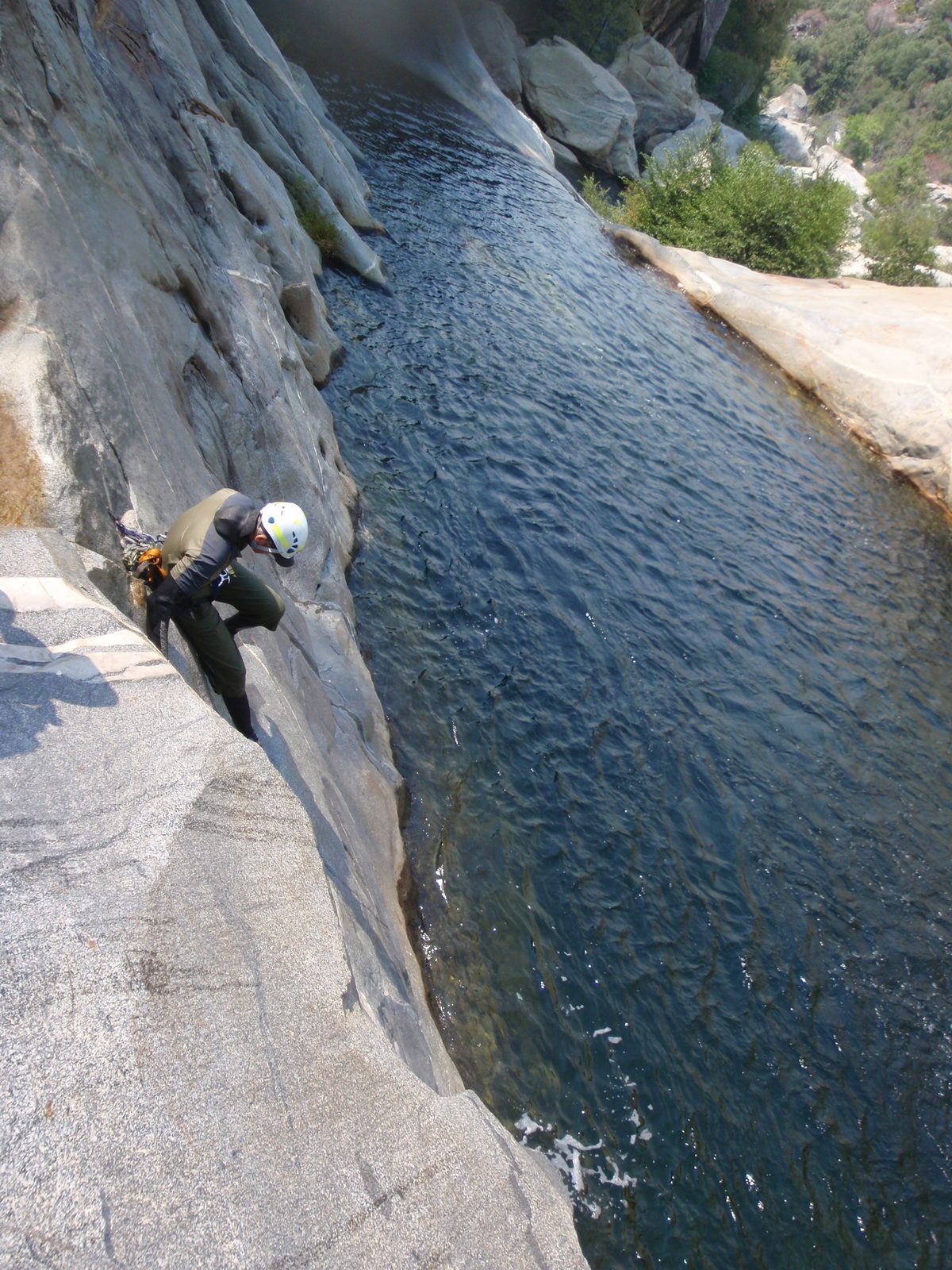Andy, attempting to get as low as possible before beginning the unavoidable slide into the water below.