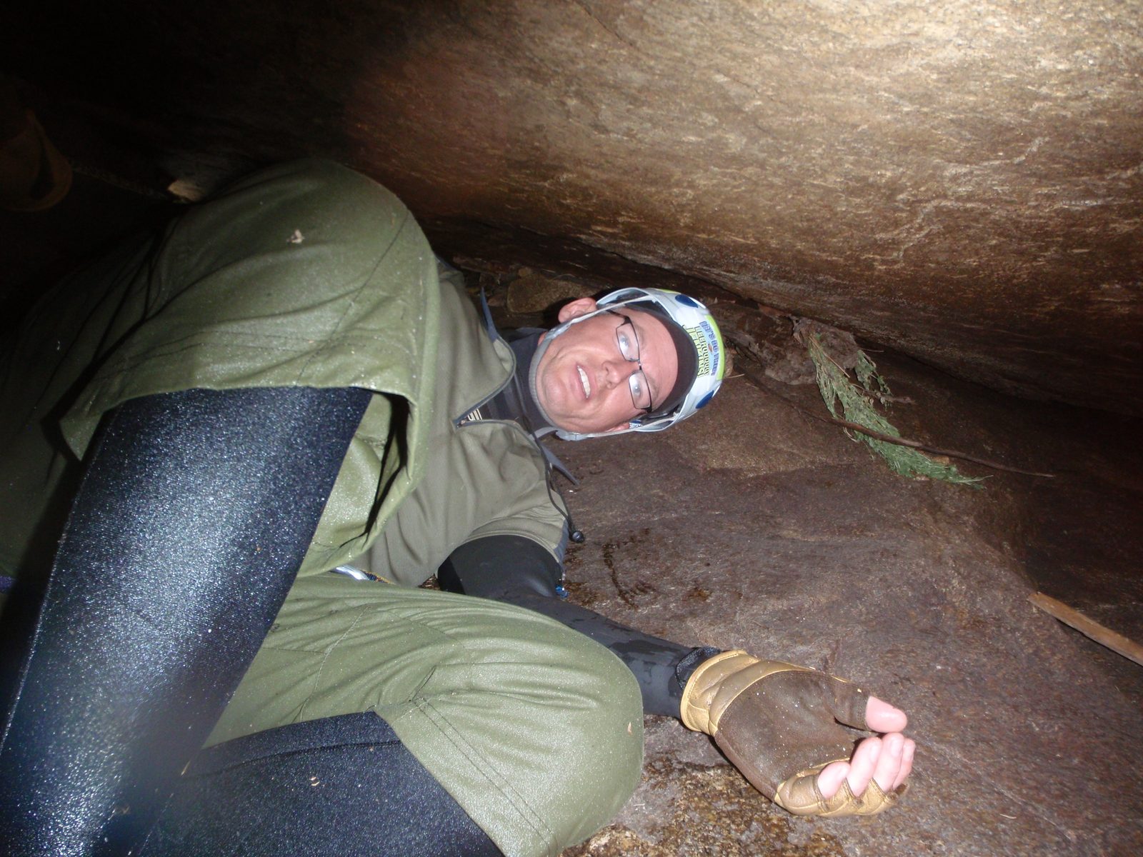 Andy, working his way under a boulder that smelled of guano.  