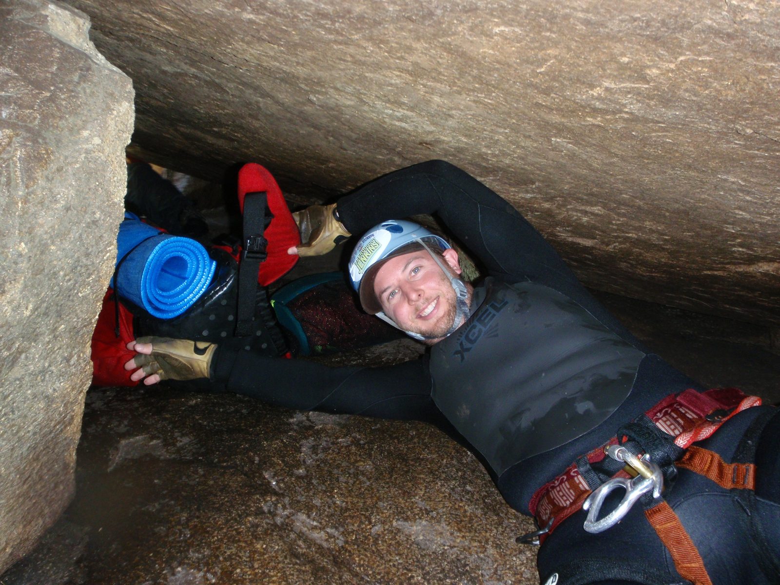 Mike, squeezing under the guano boulder.