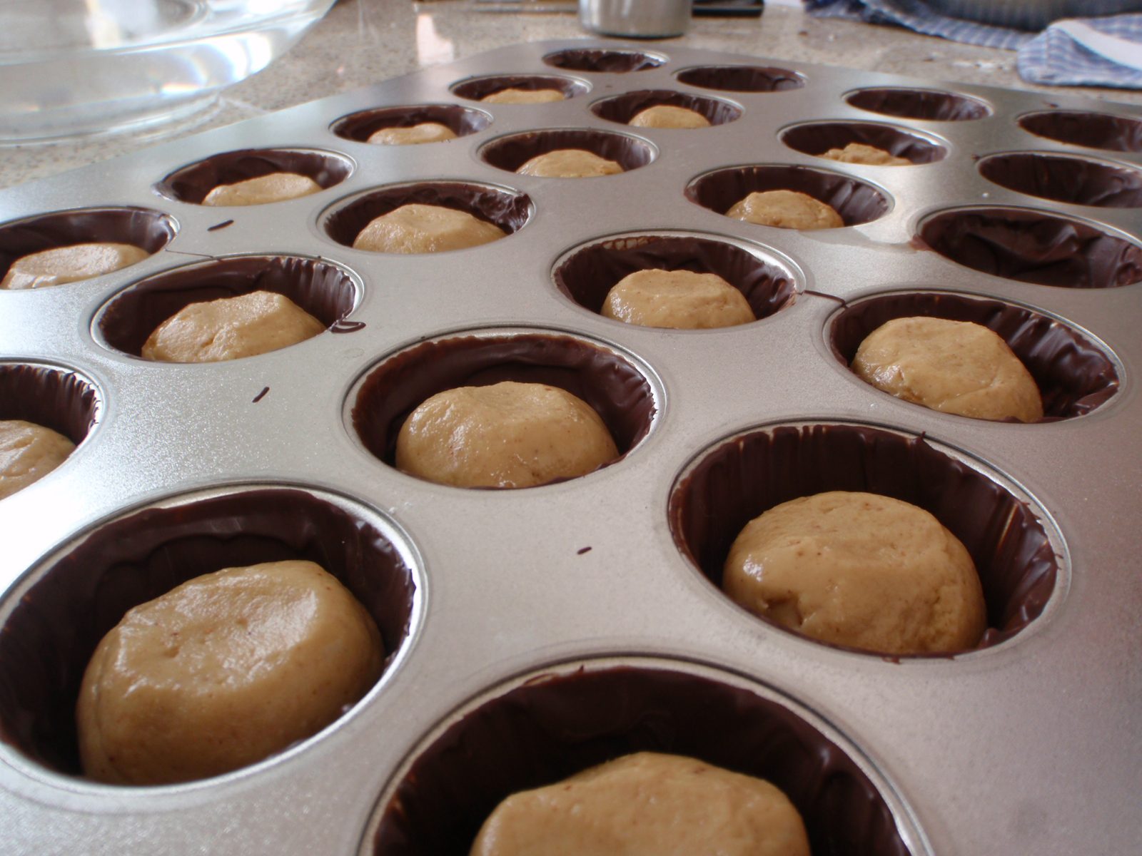 Monica brushed each of these cups with 1/16 of an inch of dark chocolate to form their shell,...