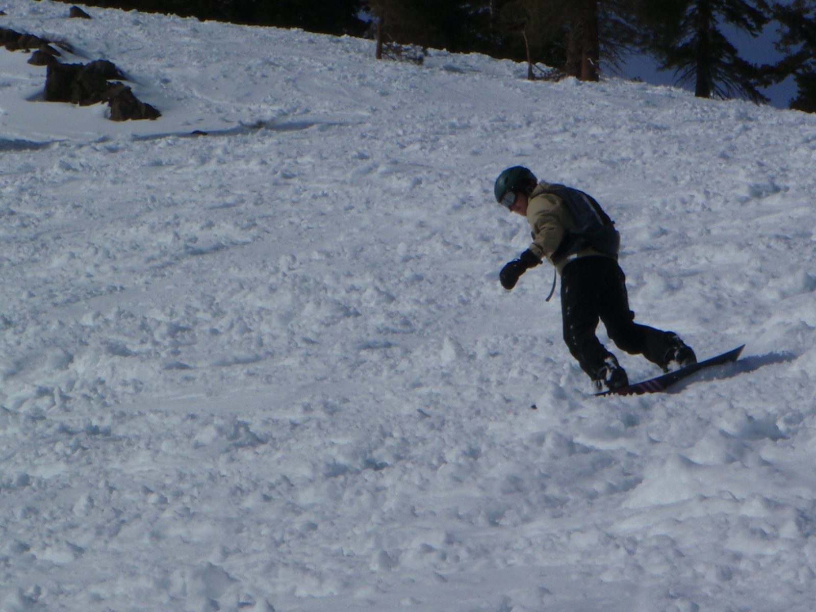 Monica boarding through some deep slushy snow at Alpine Meadows, under the Sherwood chair.
