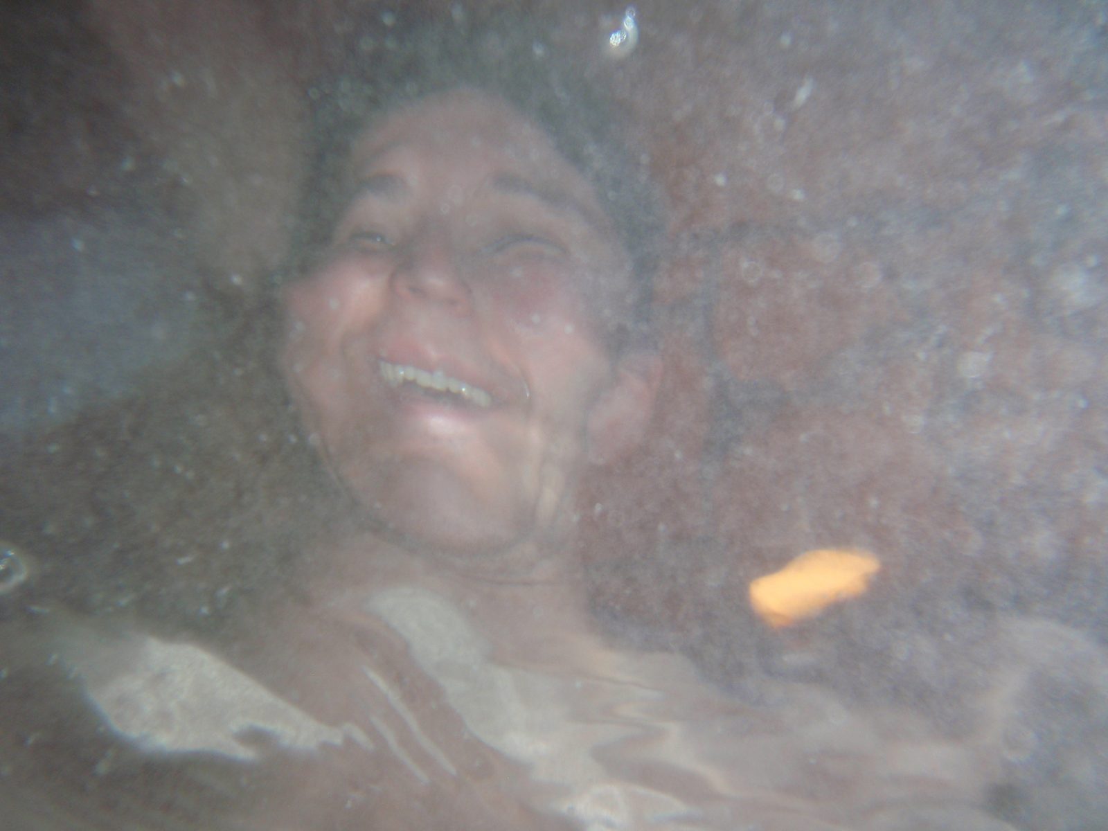 Monica's face distorted by the surface of the water.  One of John (and Jay's) patented...