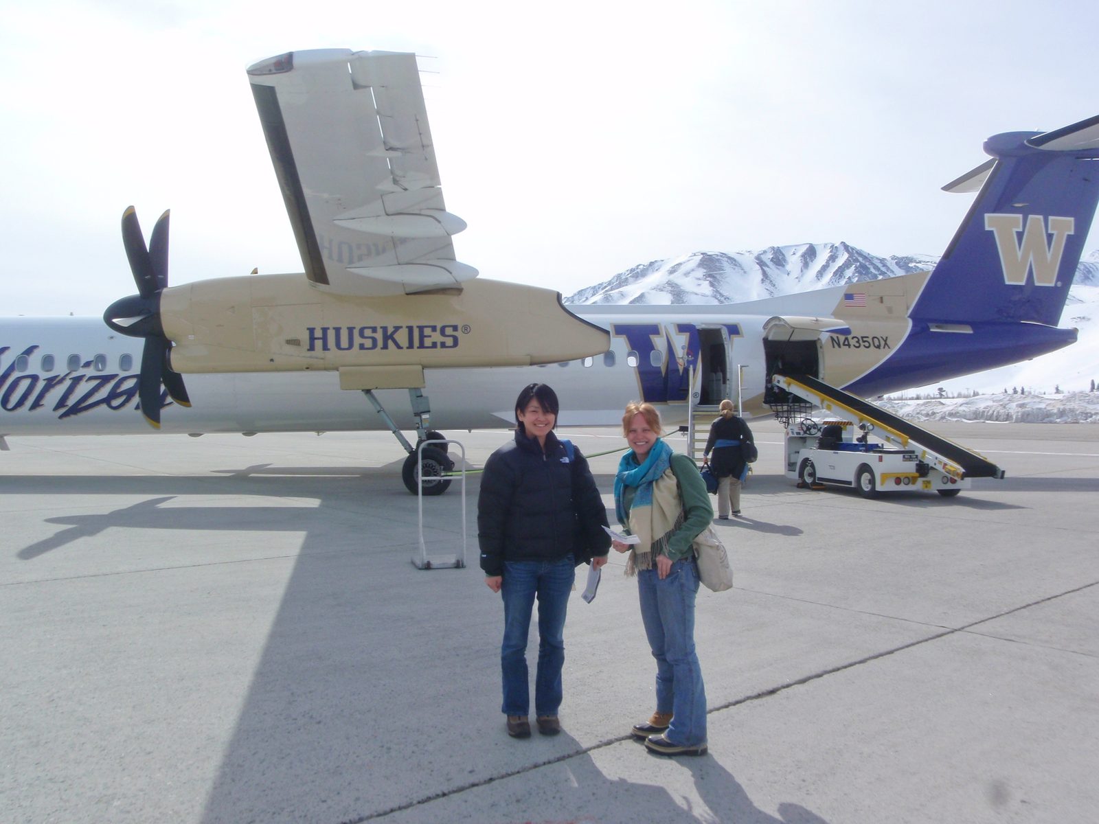 Monica and Alex giggle at the paint job on our Bombardier Q400.  Horizon/Alaska is hubbed out of...
