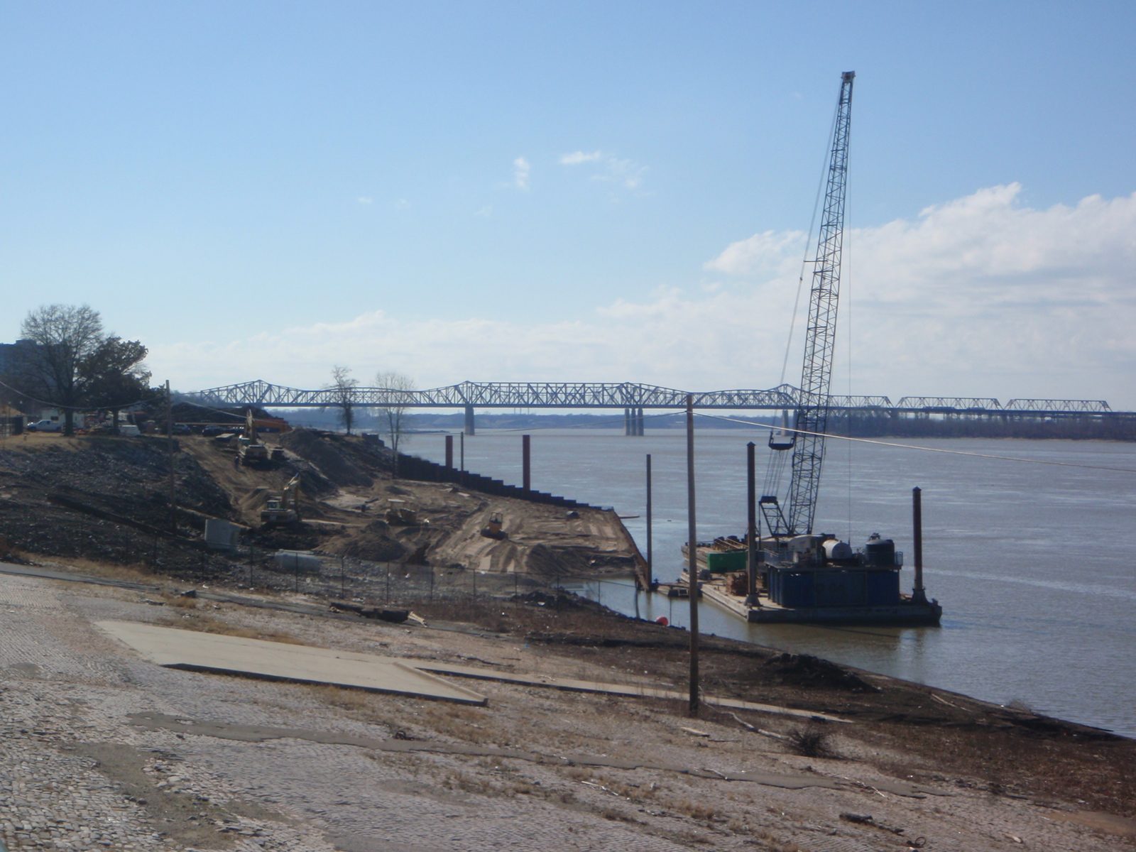 Looks like a Sisyphean task: building up the riverbank of the Mississippi for some sort of weird...