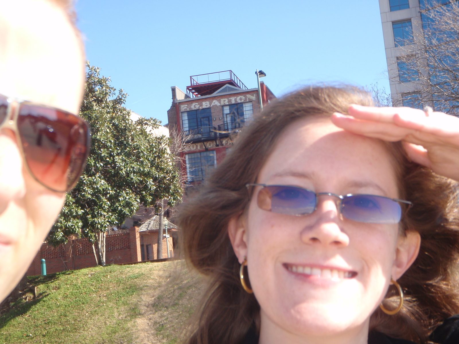Alison and the side of John's head on the riverfront.