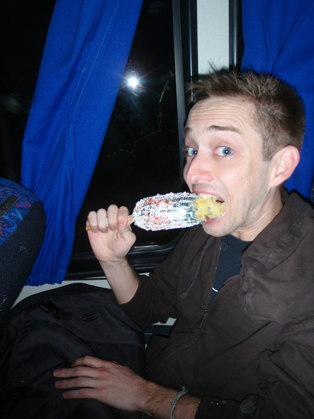 Mexican corn on a stick:  Blue corn (boiled) with mayonnaise, cheese, and chilis.  5 pesos, or...