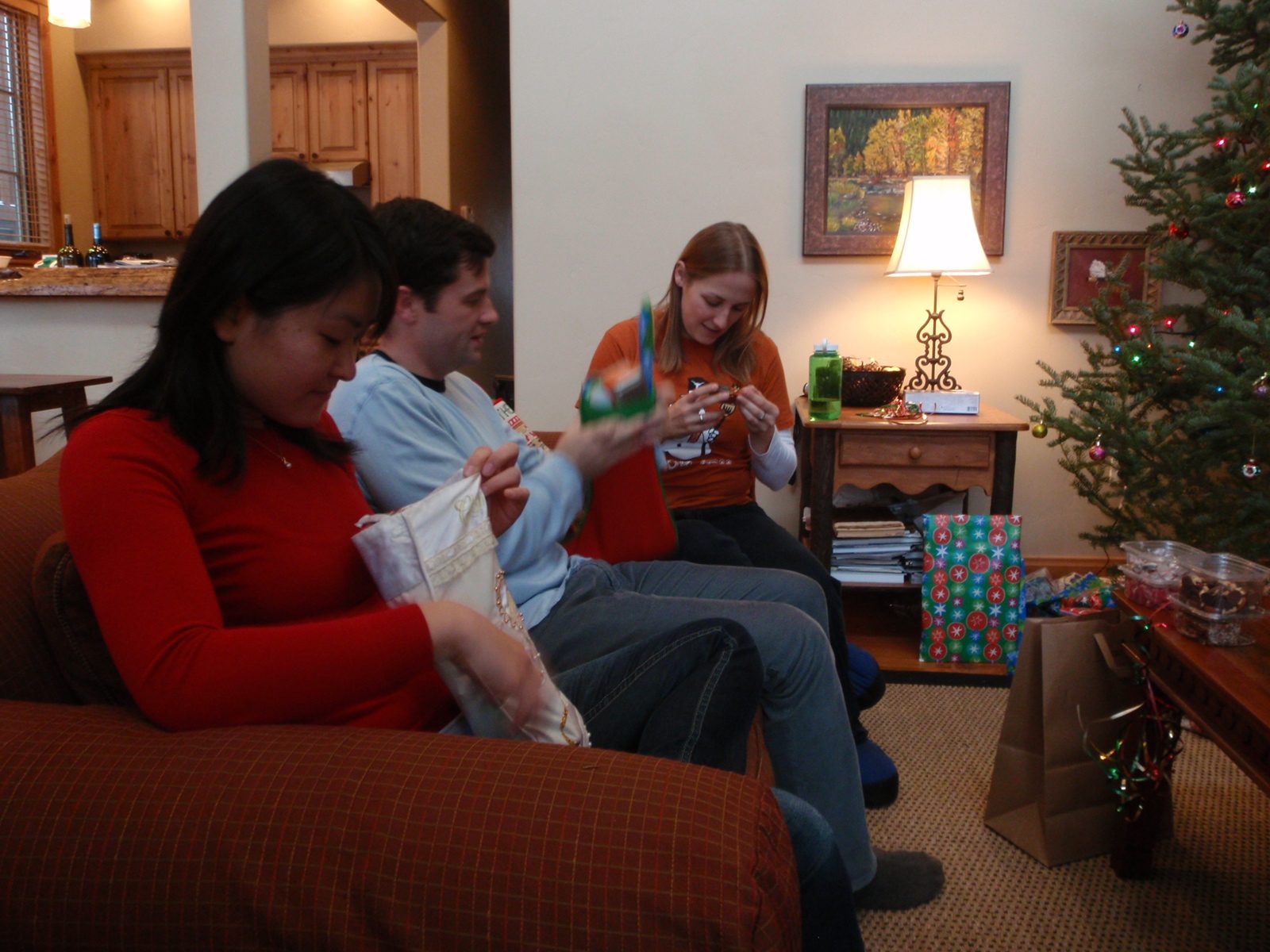 Monica, Jay and Catherine opening presents on Christmas morning. 