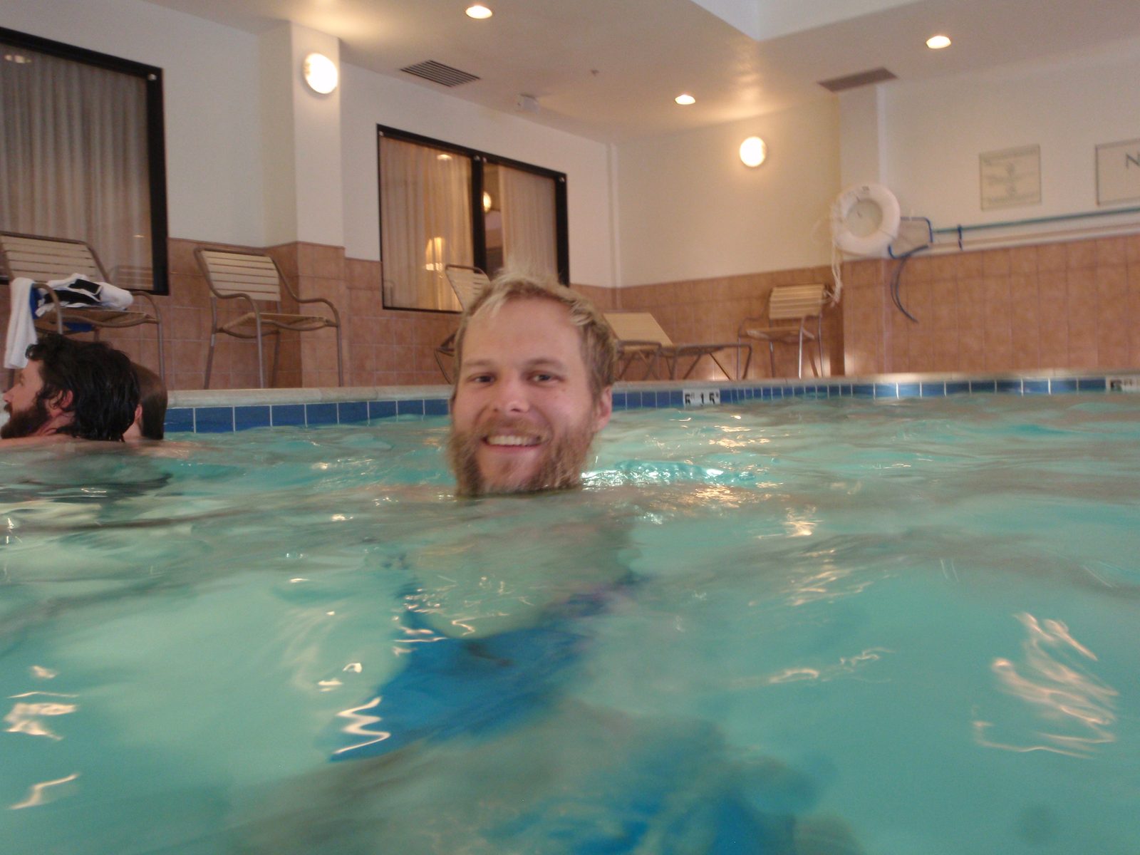 John, still splashing, and keeping his hair pretty dry.