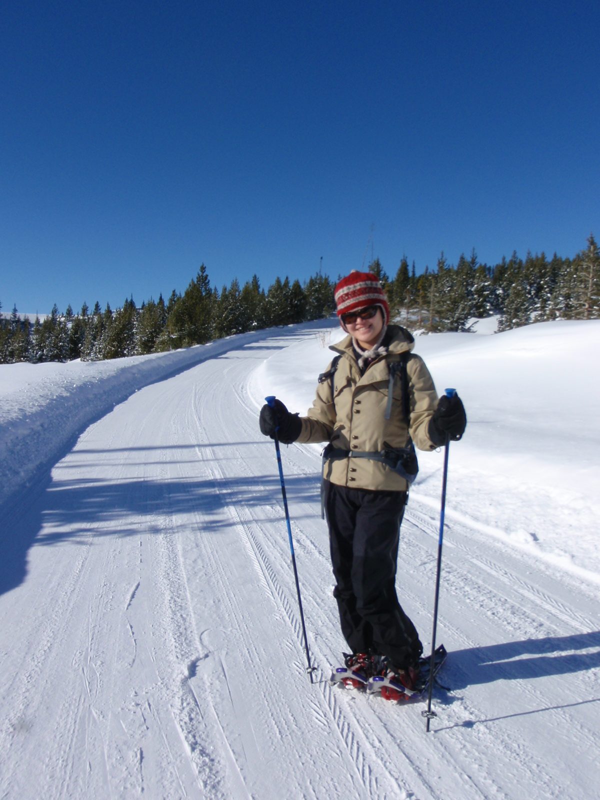 Monica, snowshoeing down the road to Beehive Basin.
