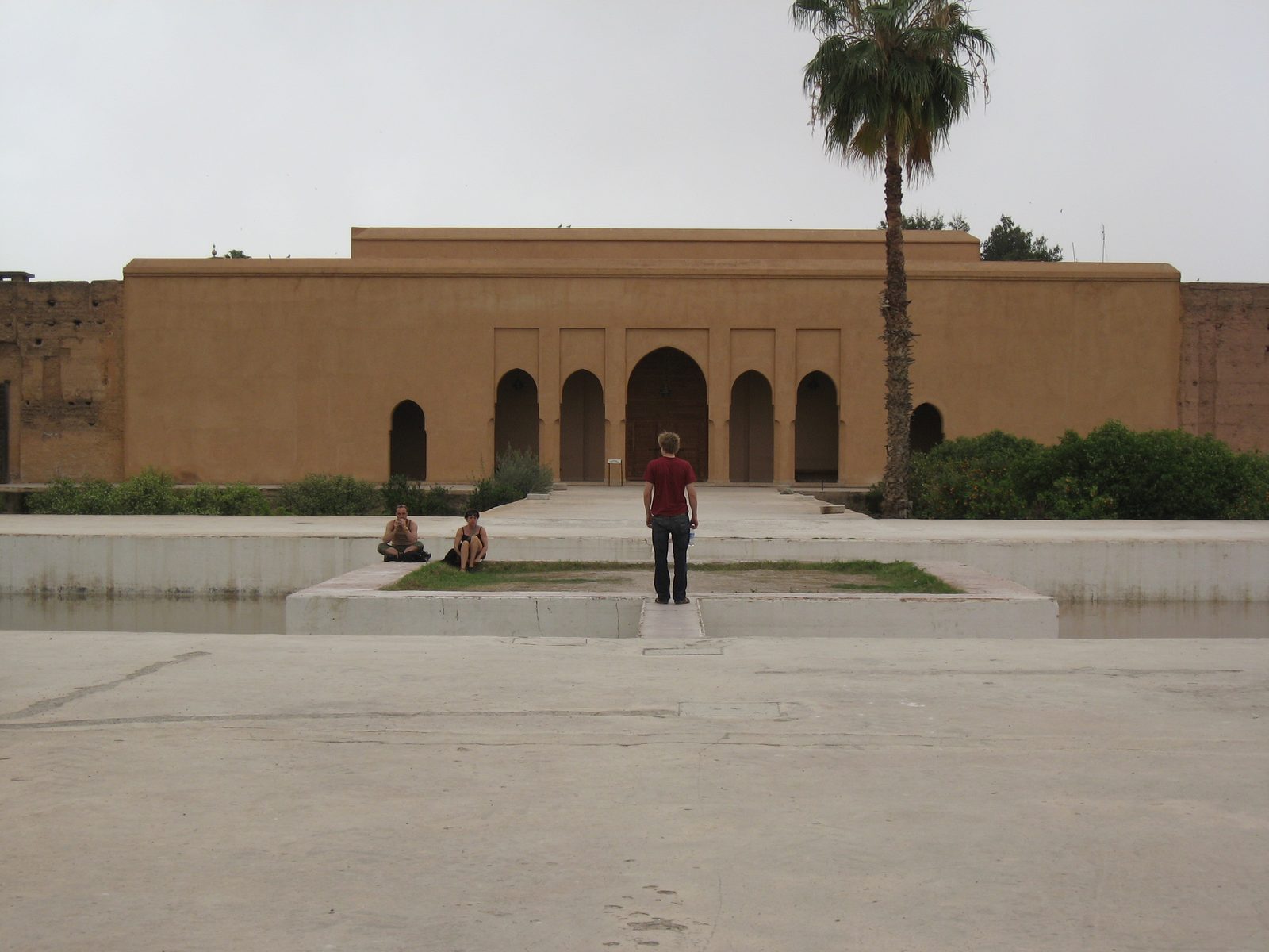 Trevor walking across a pool in the El Badi Palace.