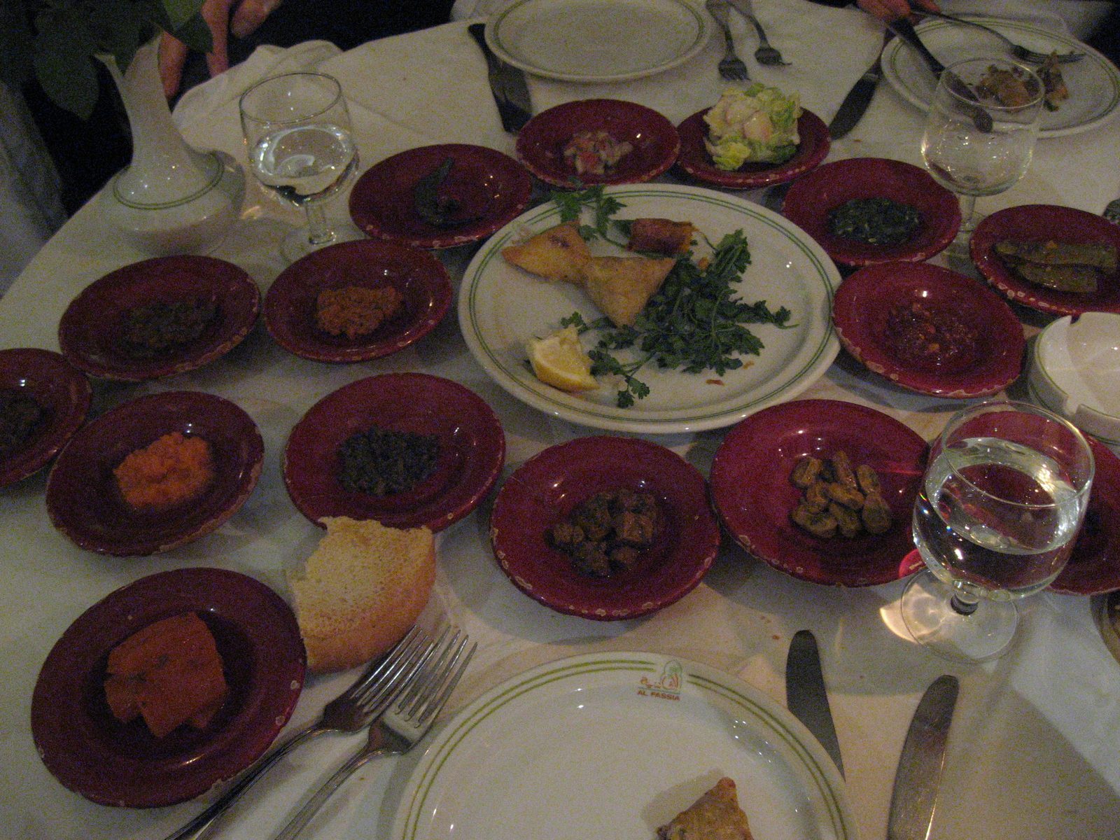 At least 15 small plates plus one larger plate which came when we ordered one appetizer for our table. 