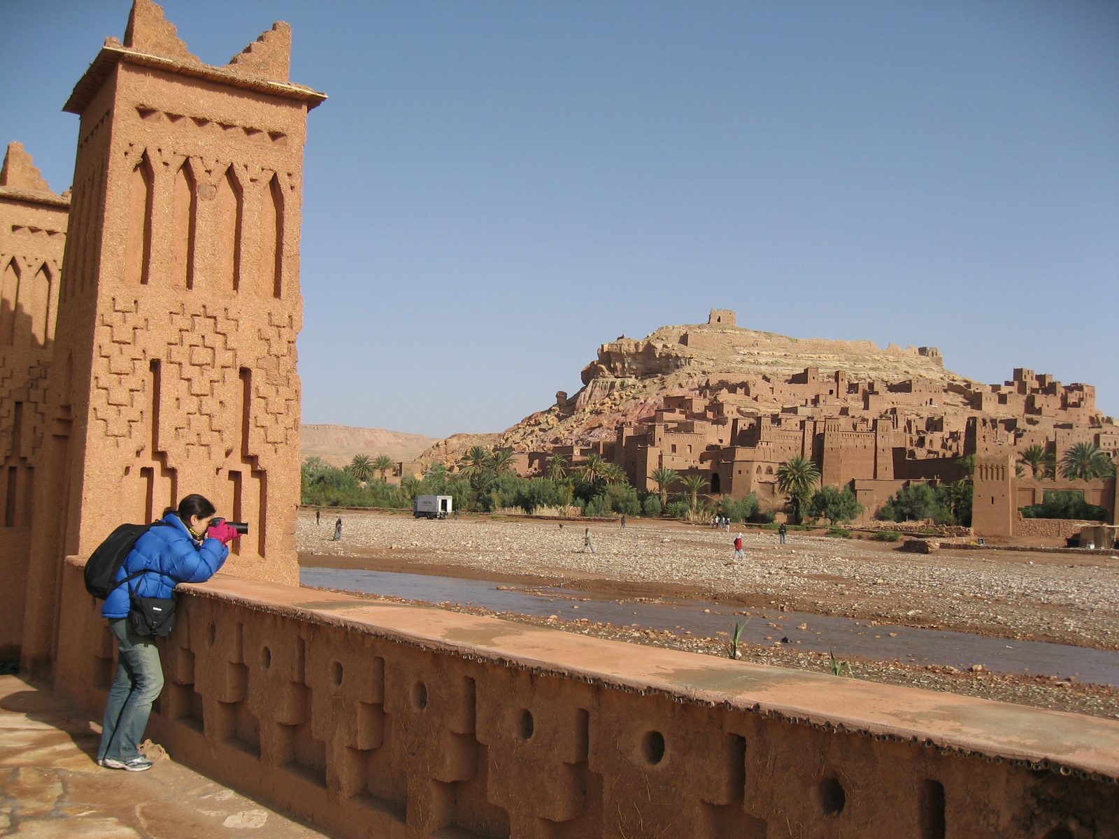 Heidi taking a photo with the Ait Bennadou Casbah in the background.  This city has been used to...
