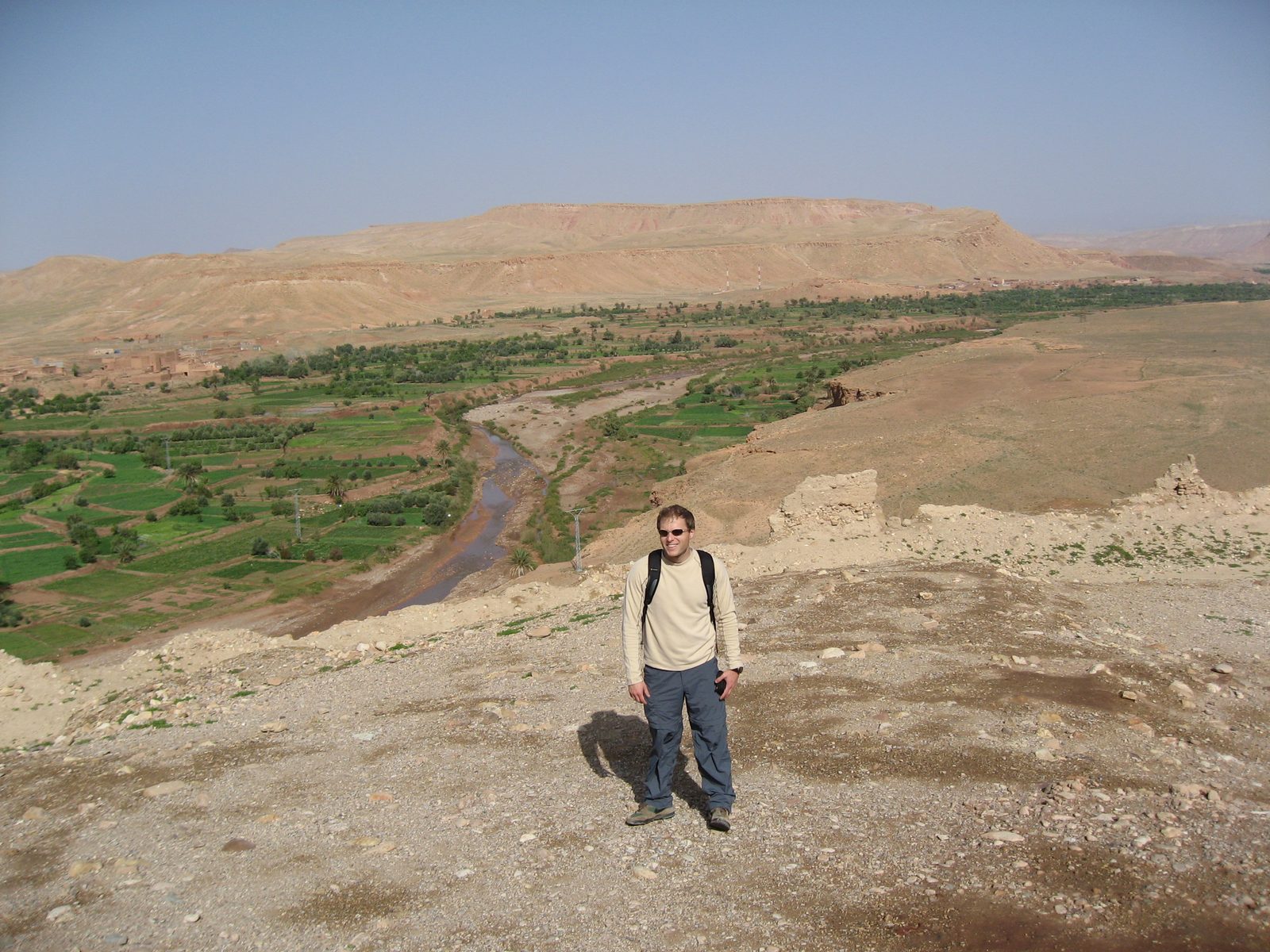 John at the top of the Ait Bennadou Casbah with the river that one would follow to the Atlas...