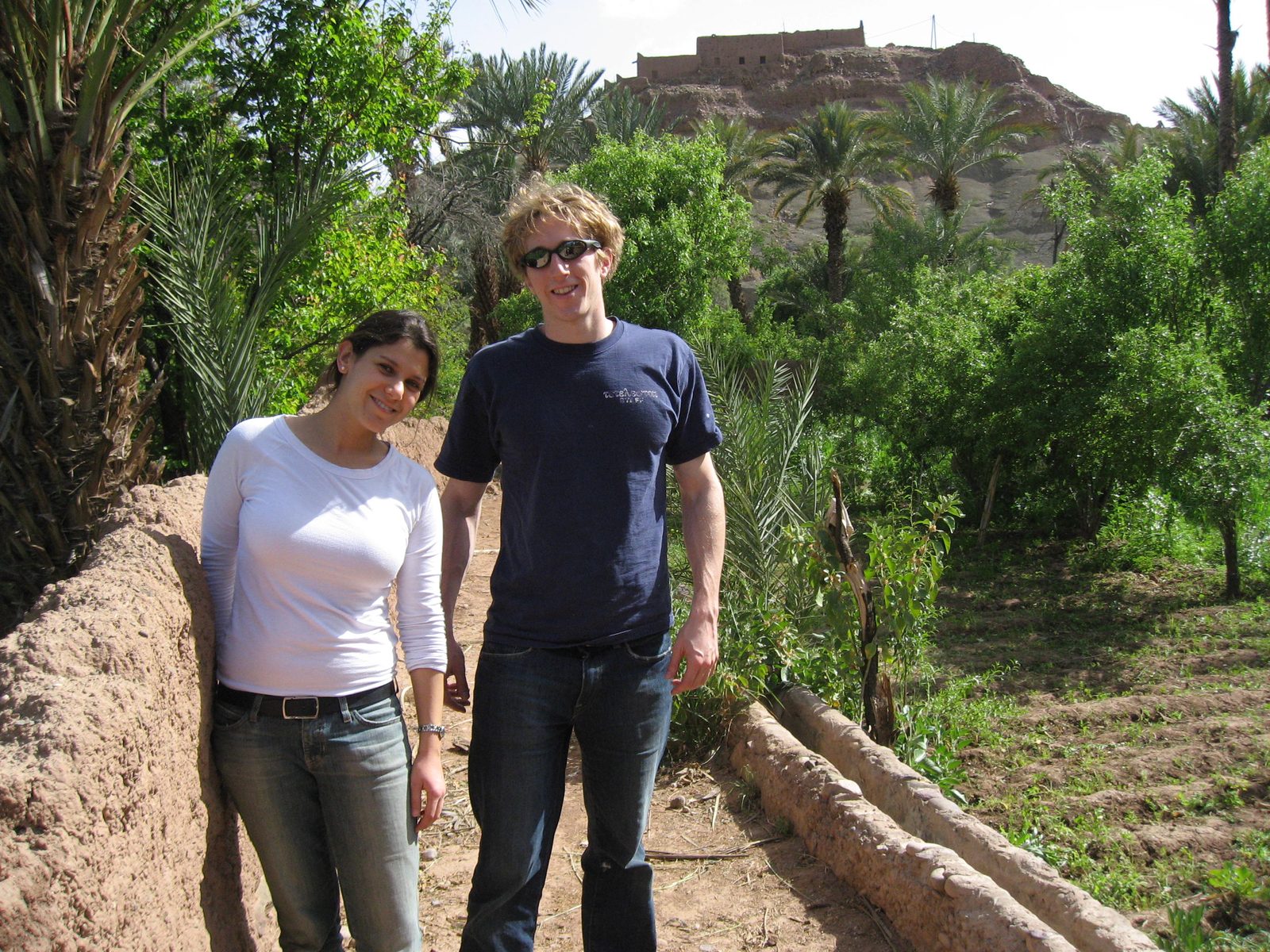 Heidi and Trevor wandering around an irrigated pea-pod patch.  I tried one of the pea-pods.  It...