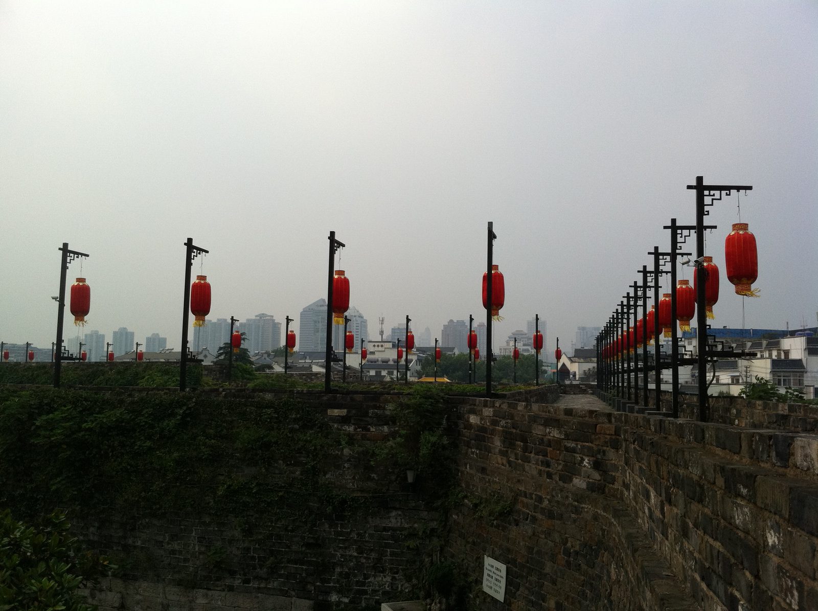 Standing on top of the old city wall of Nanjing, which originally had a length of about 34...
