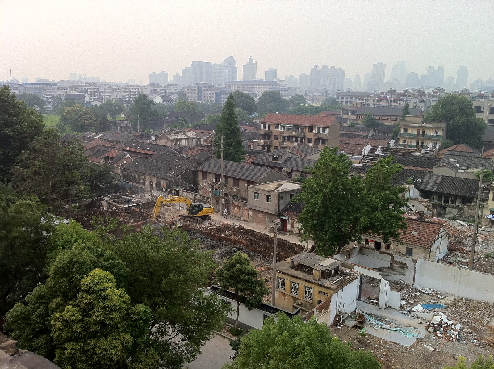 High dynamic range (HDR) shot of condemned neighborhoods being worked on by demolition crews and...