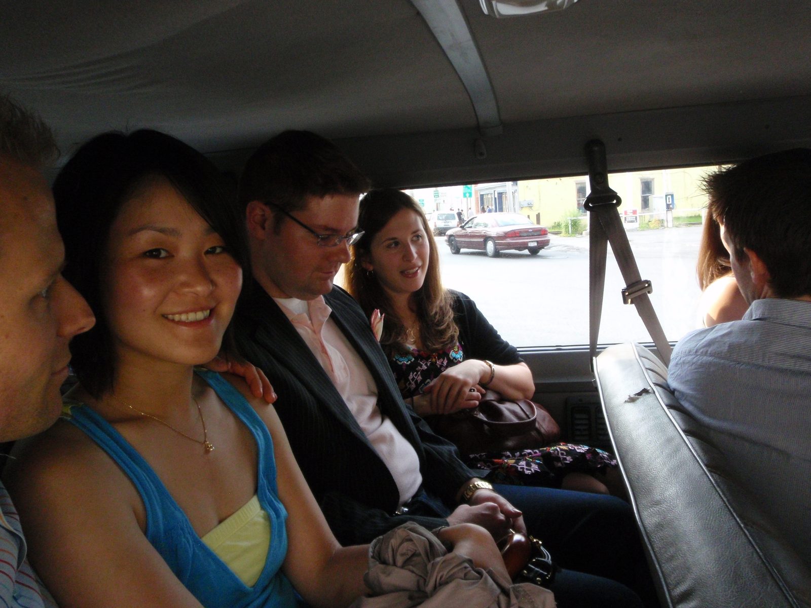 Headed to the rehearsal picnic in rented 15-passenger vans. Monica, seated next to Steven (one...