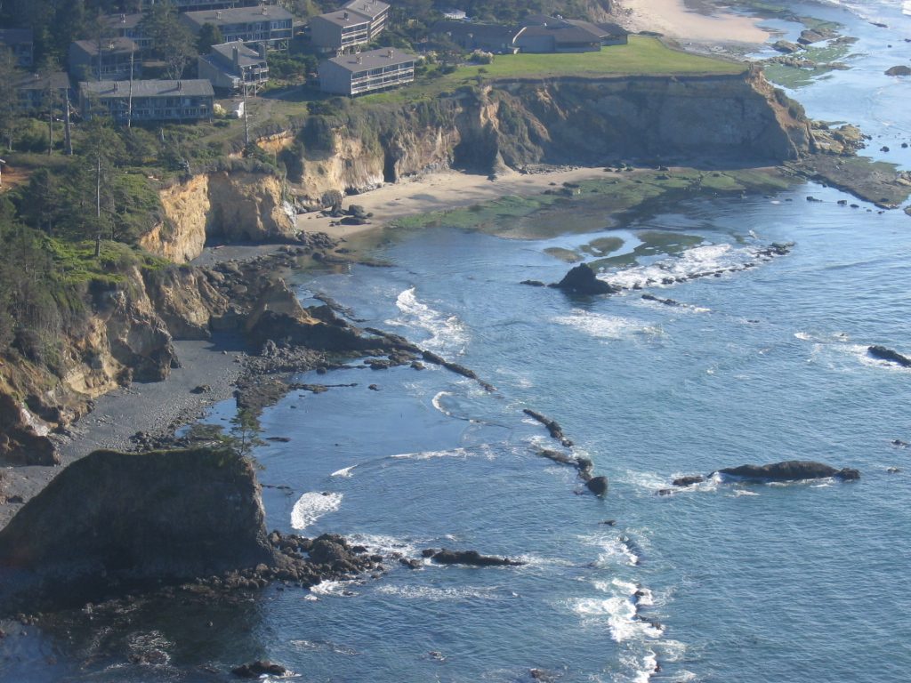 Erosion-resistant lava dikes visible from Cape Foul Weather.  Condo community slowly sliding...