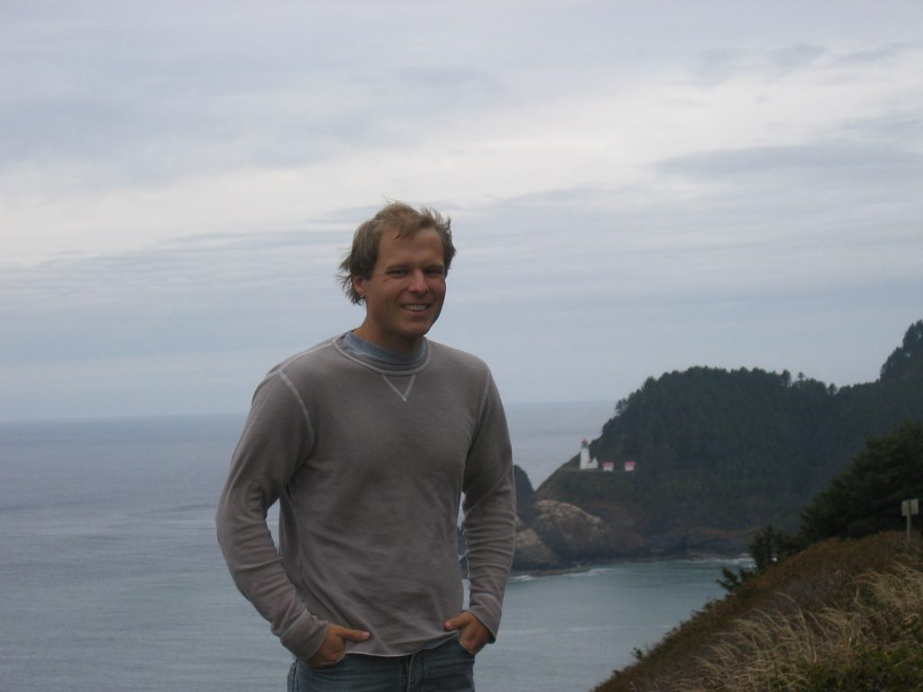 John in front of the Heceta Head Lighthouse.