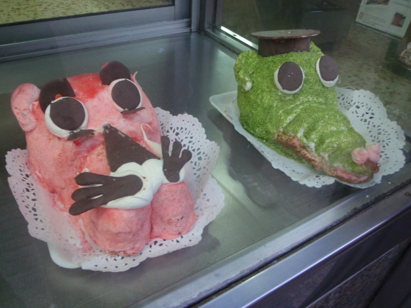 Cute cakes in a bakery in Montevideo.  Pink Panther on the left, I guess.  On the right, well,...