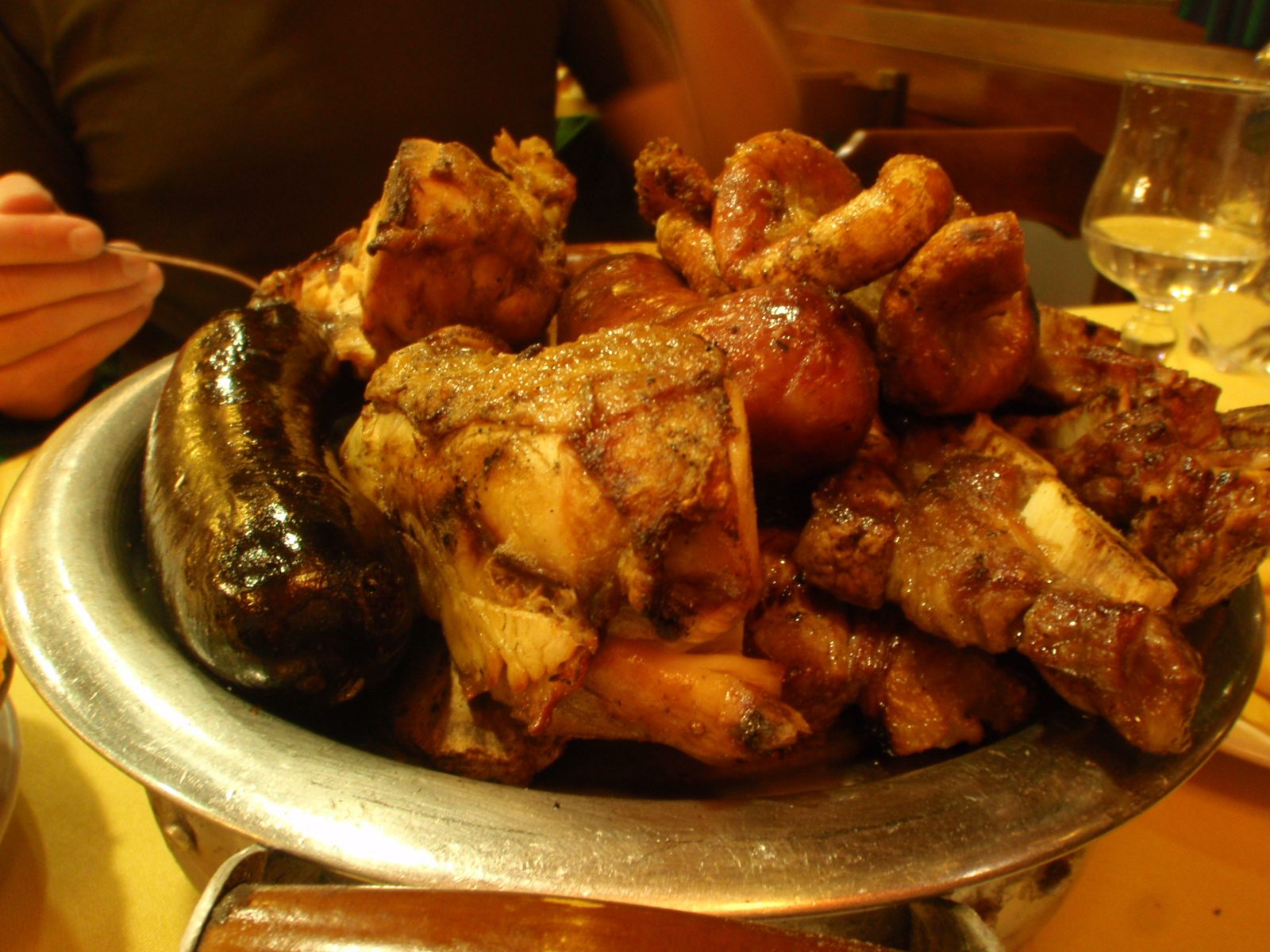 Close up of blood sausage, intestine, and other non-vegetarian food items.