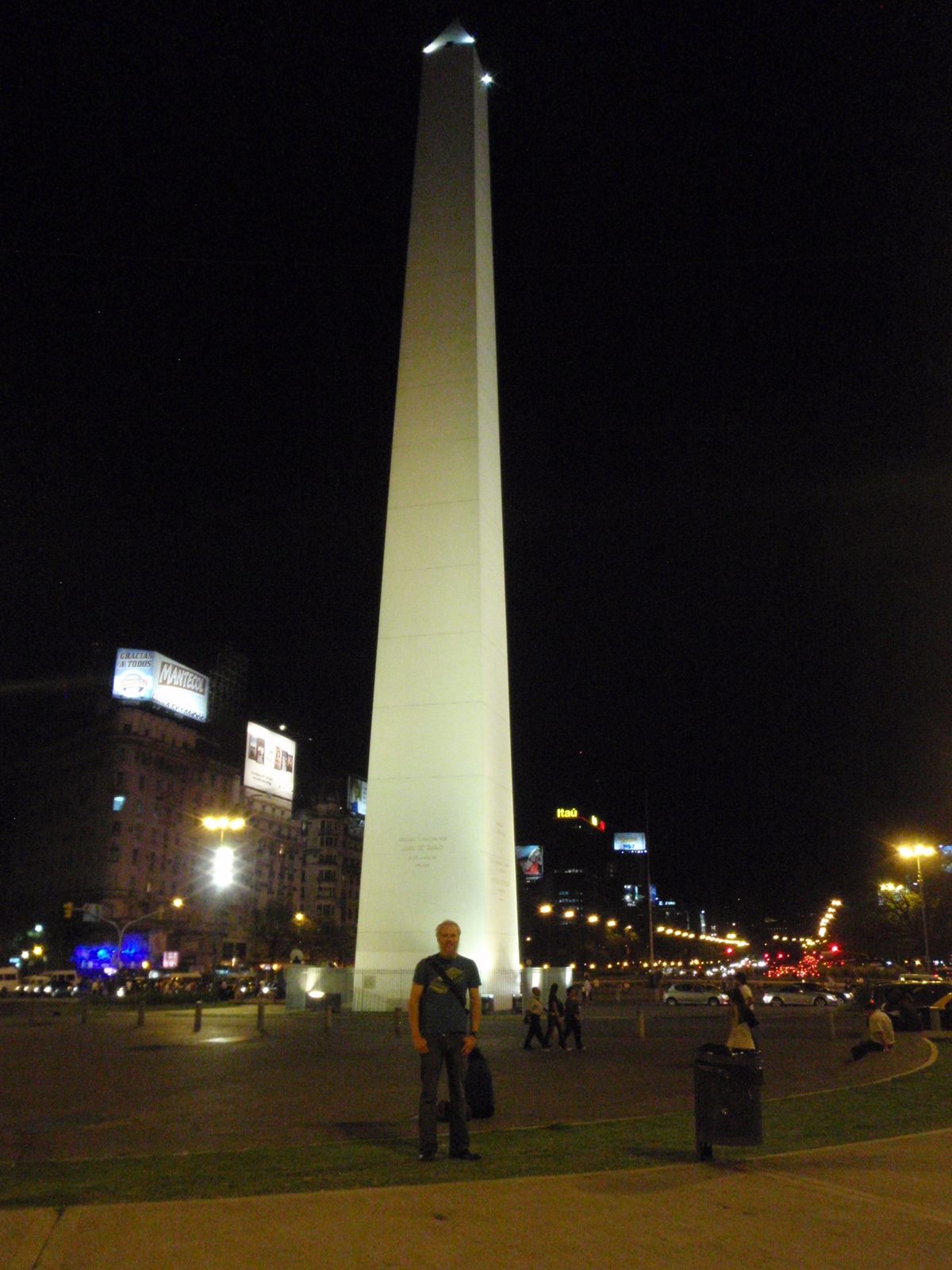 John in front of the obelisco at night.