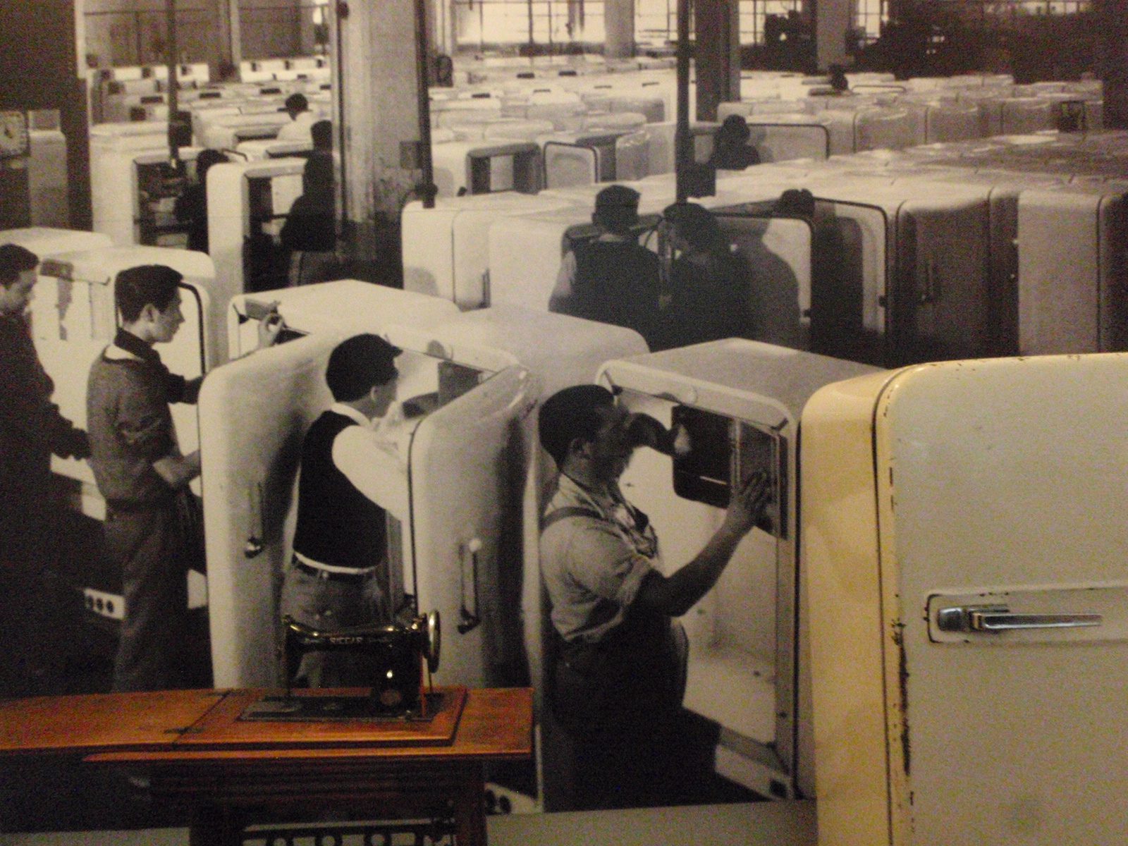 Photograph of refrigerators being built in a factory in Argentina in the 50s.