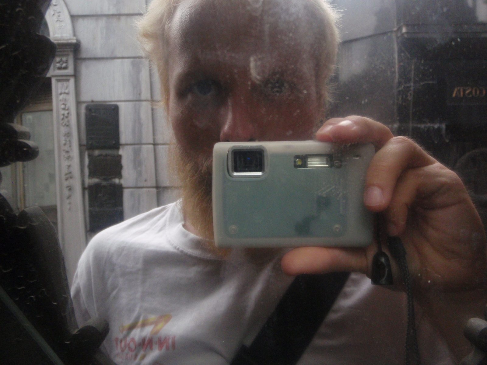 Self portrait in a mirror of a mausoleum.