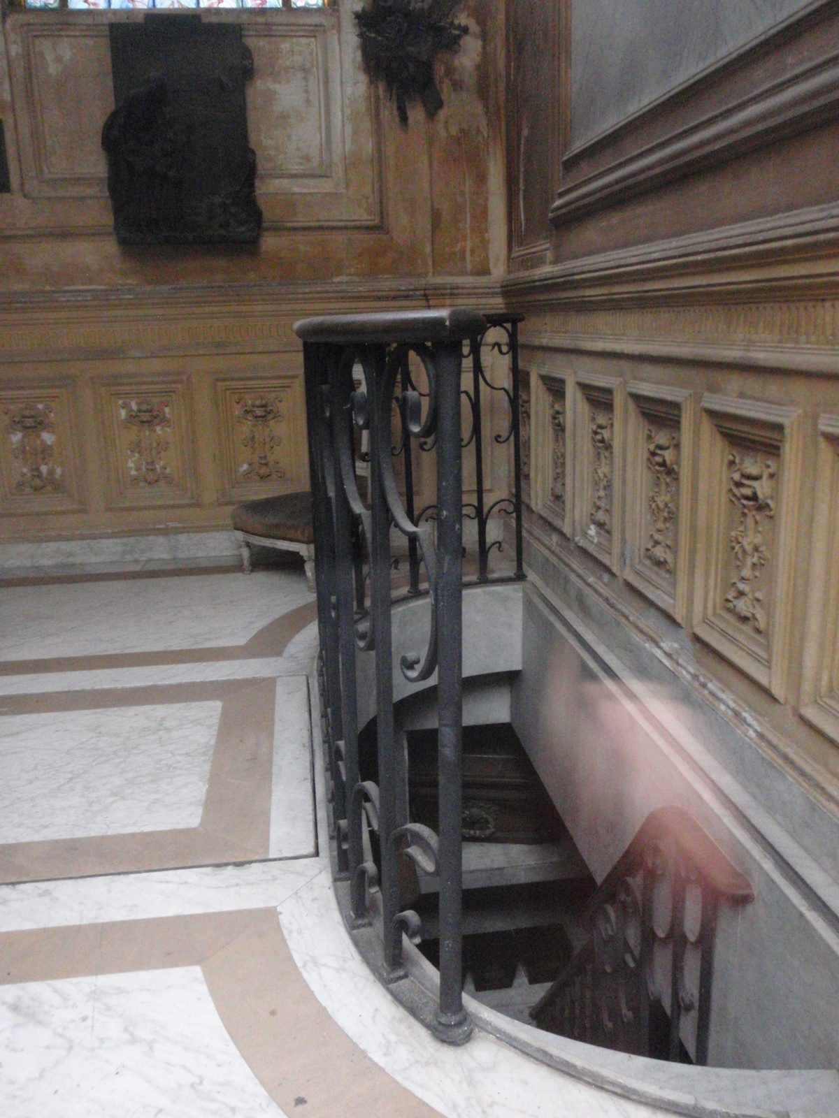 Stairs with dead people at the bottom.