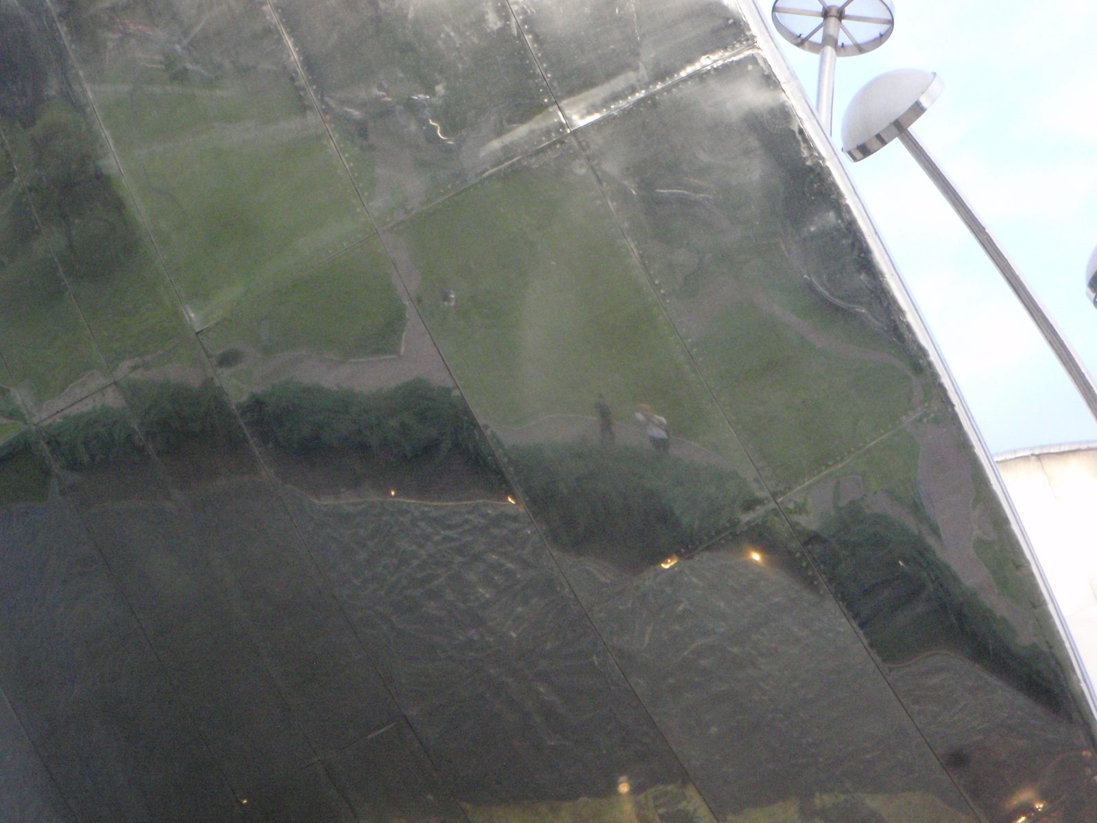If you look closely, you can see our reflection in Floralis Genérica.