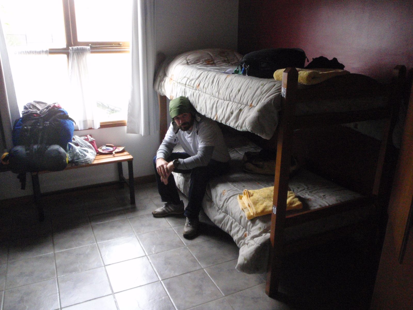 Jay and I settle into our temporary bunks at La Posta youth hostel while the staff readies our...