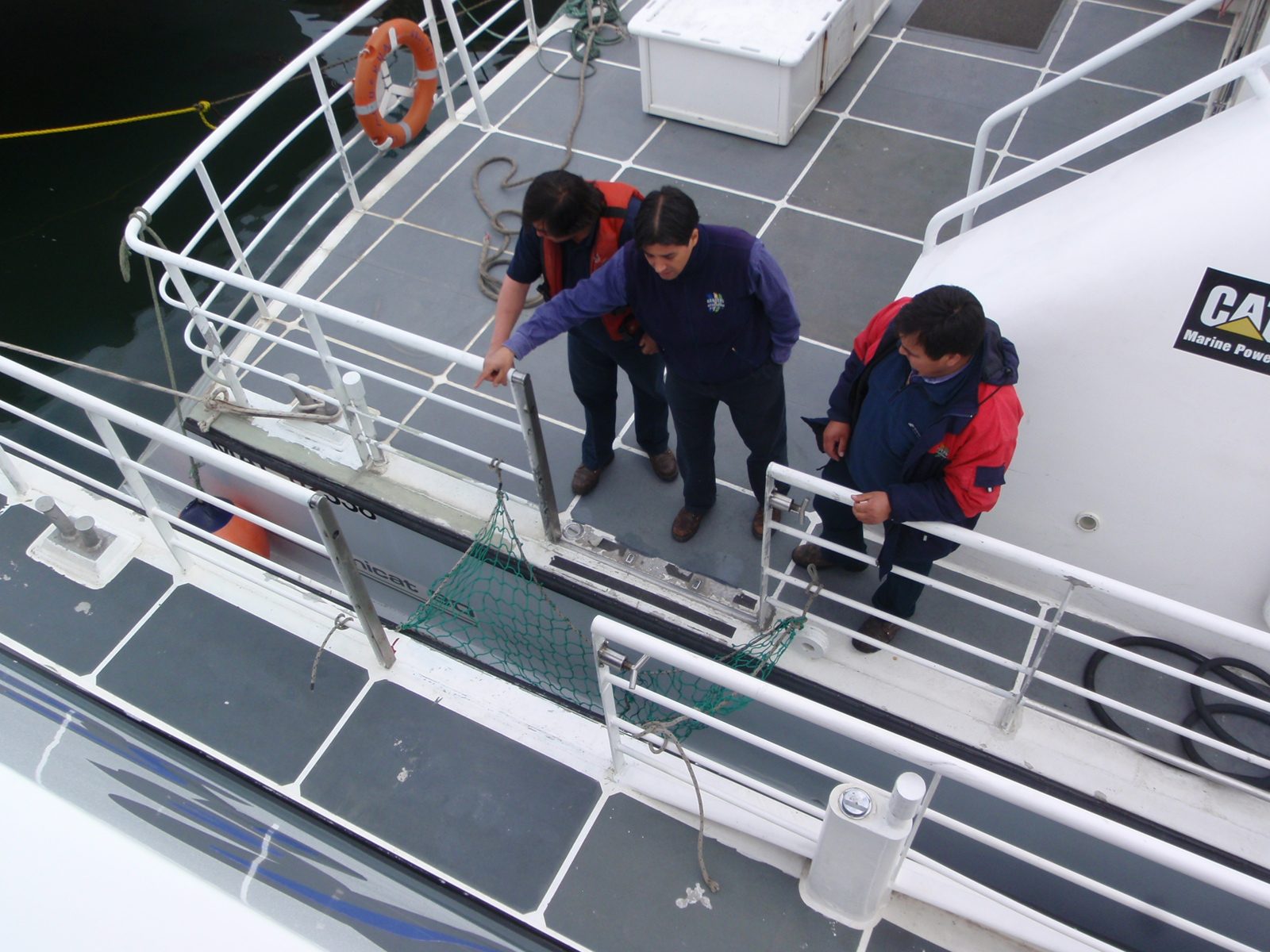 The staff getting ready to let people off the boat.