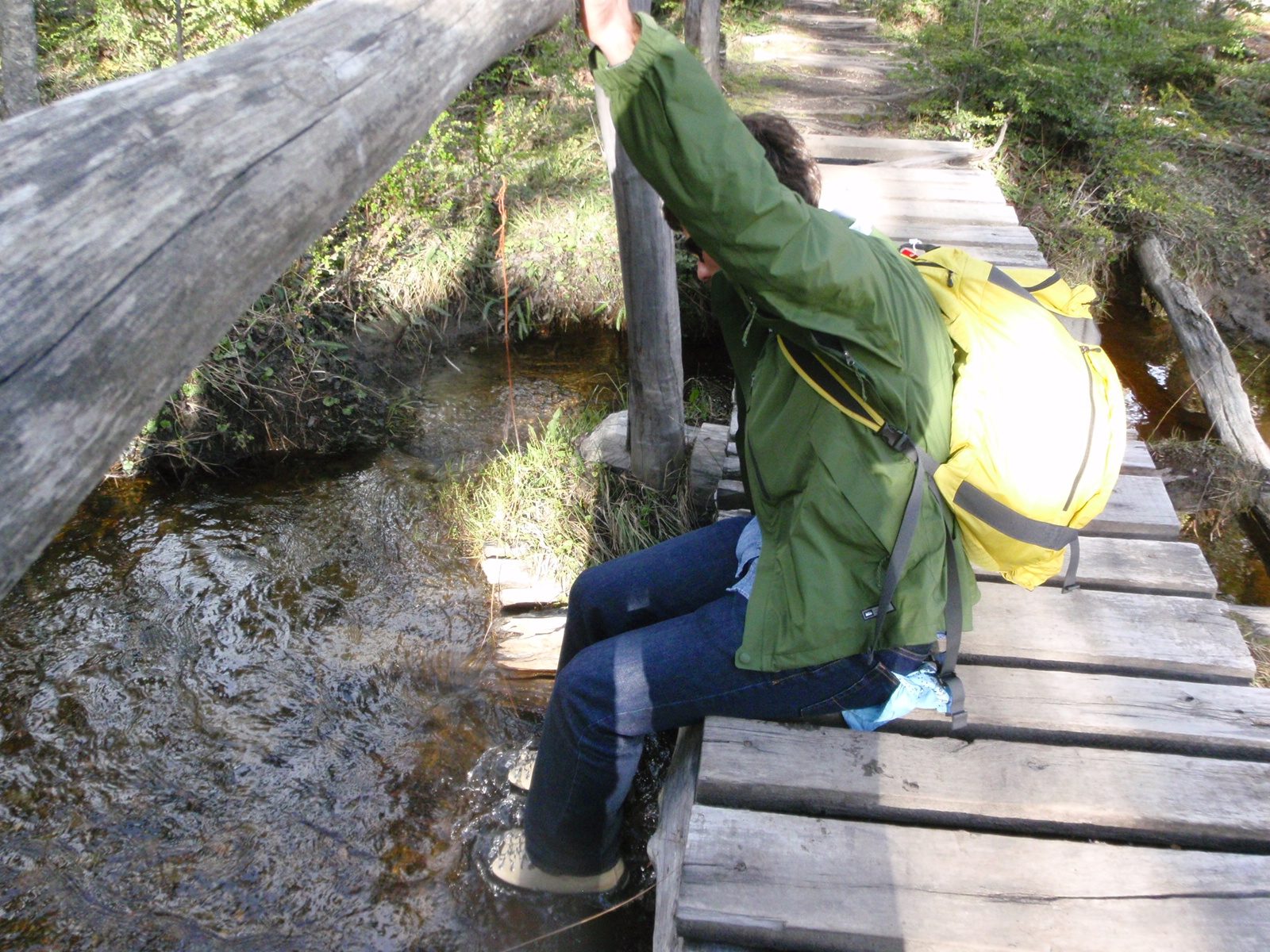 Washing the salt off our hiking boots by a small footbridge.