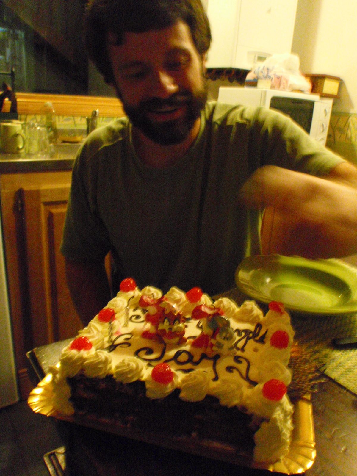 Jay cutting up some birthday cake.