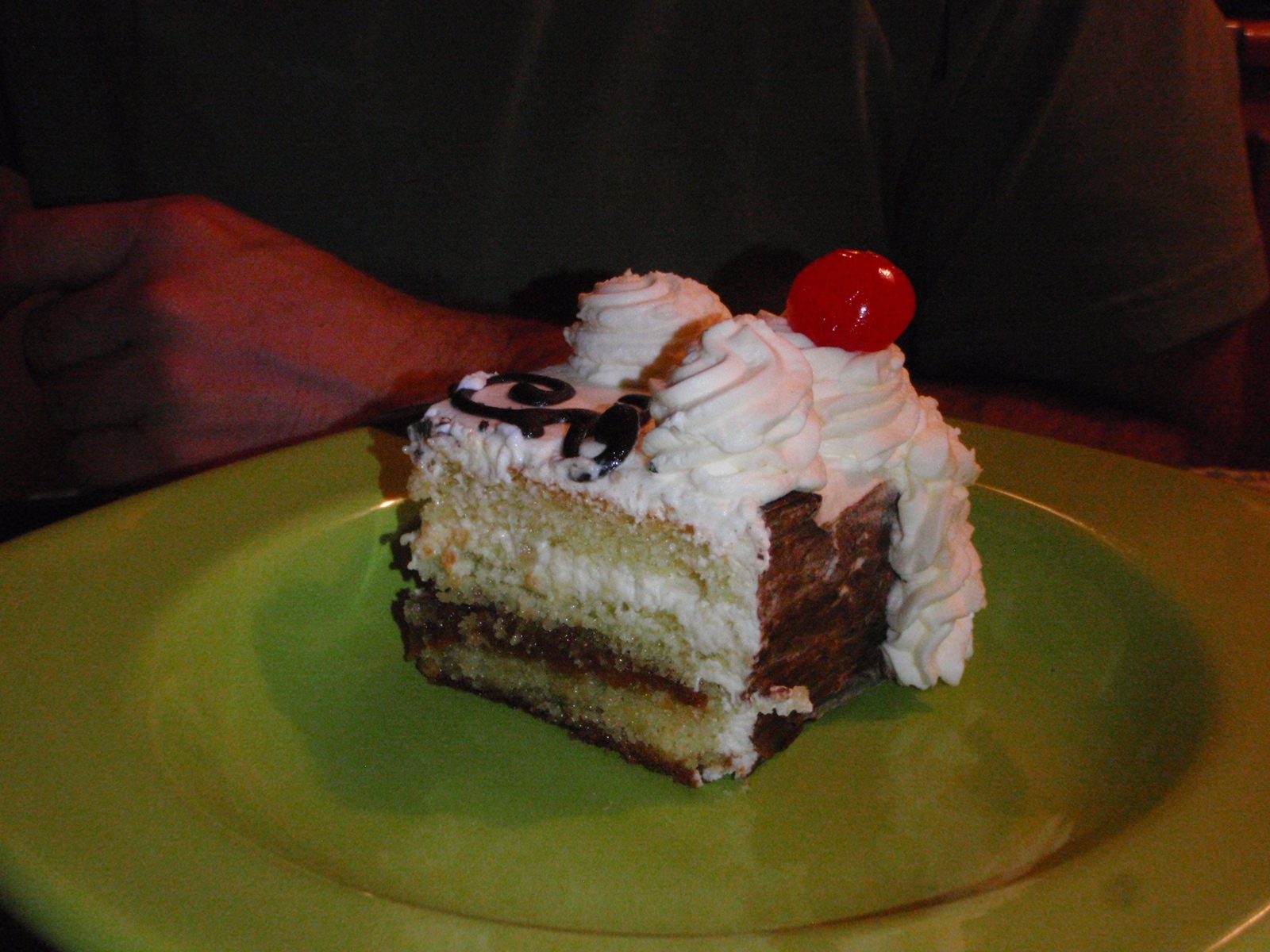 The cake was a dulce de leche / tres leches cake with pineapple and cherry and chocolate.  It...