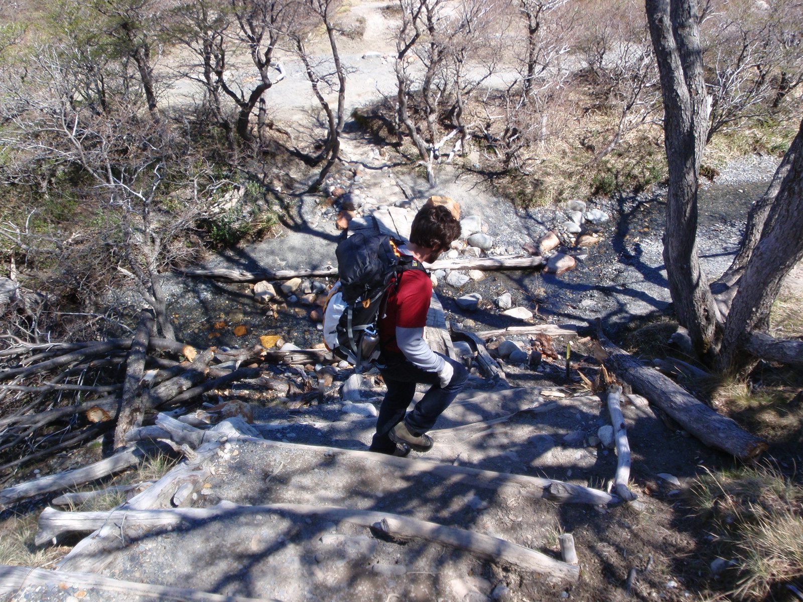 Walking down some steps to a small stream crossing.