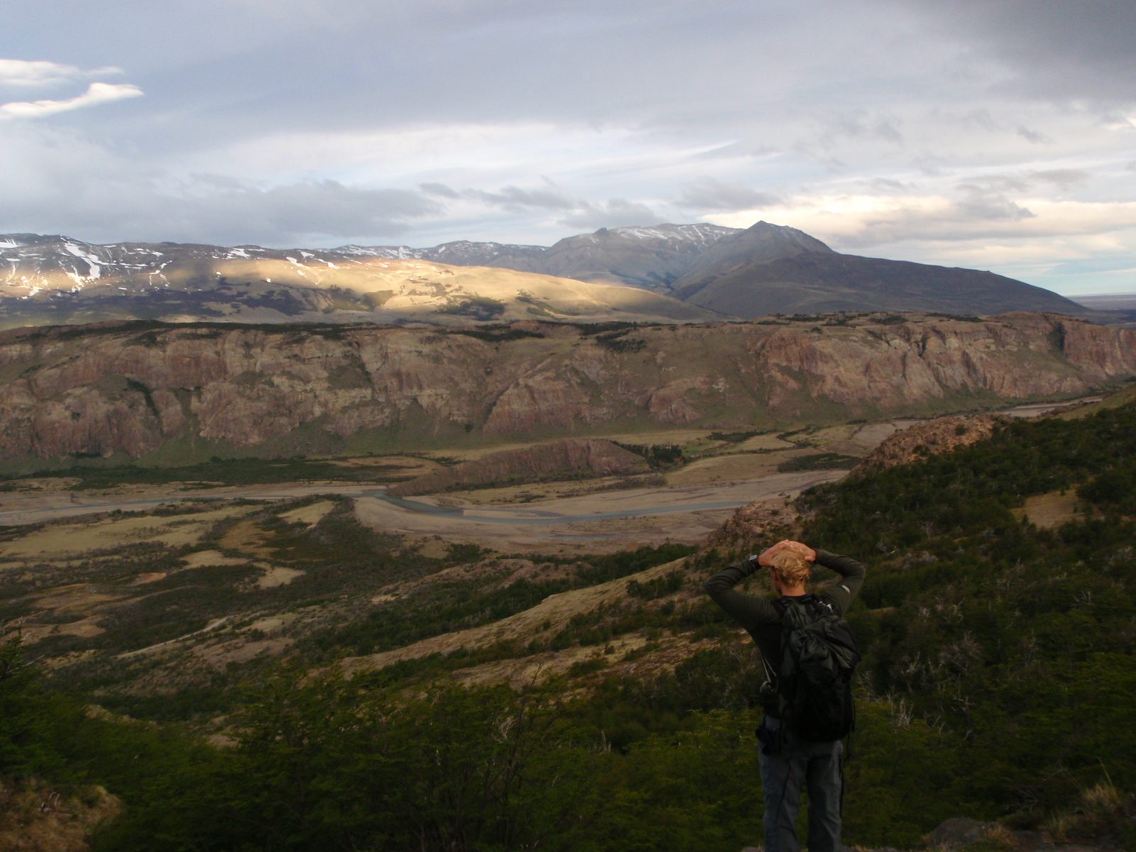 John, pondering the vast valley below.