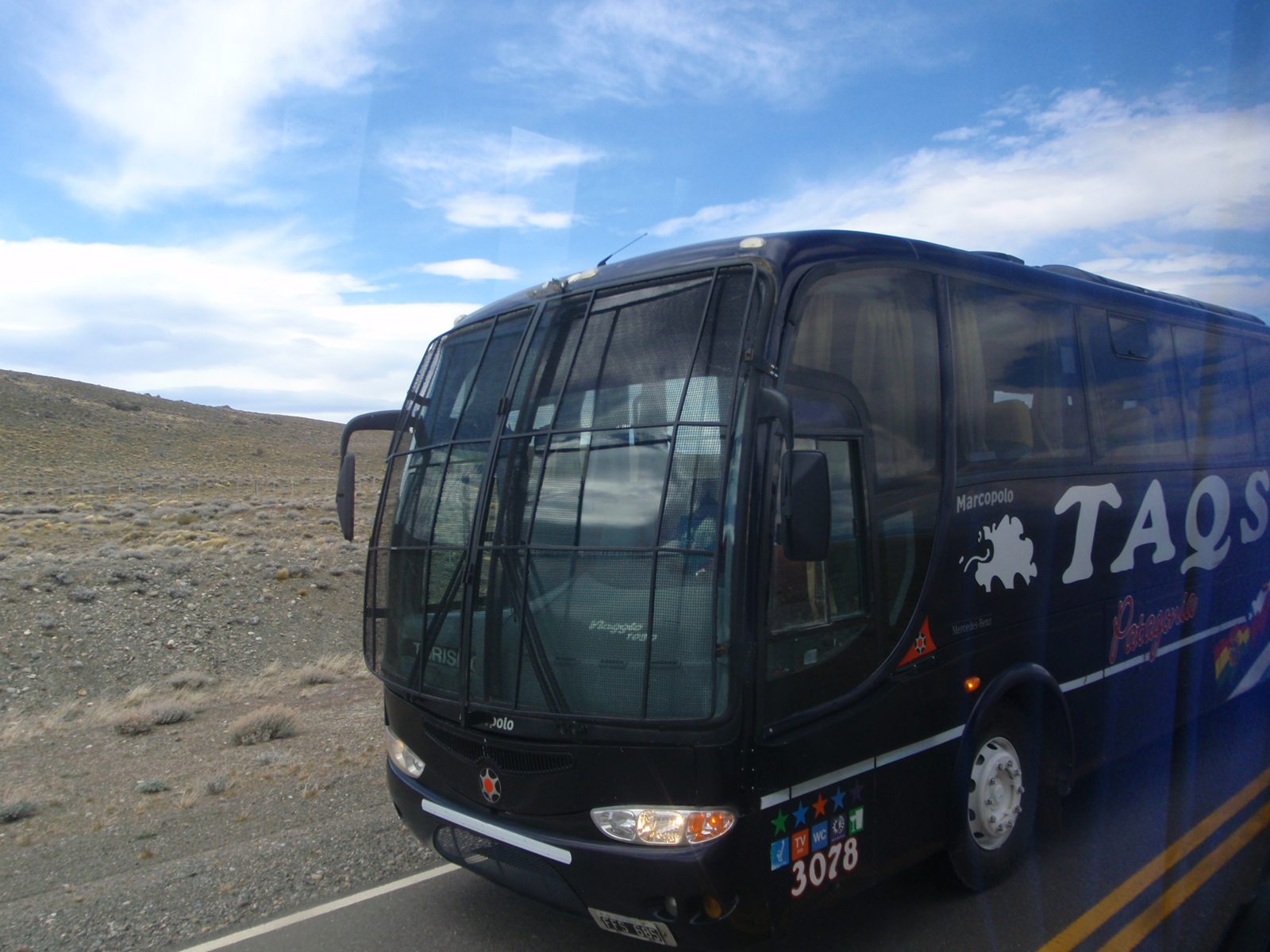 Some of the buses we saw had steel fences on the windshields with a small hole where the driver...